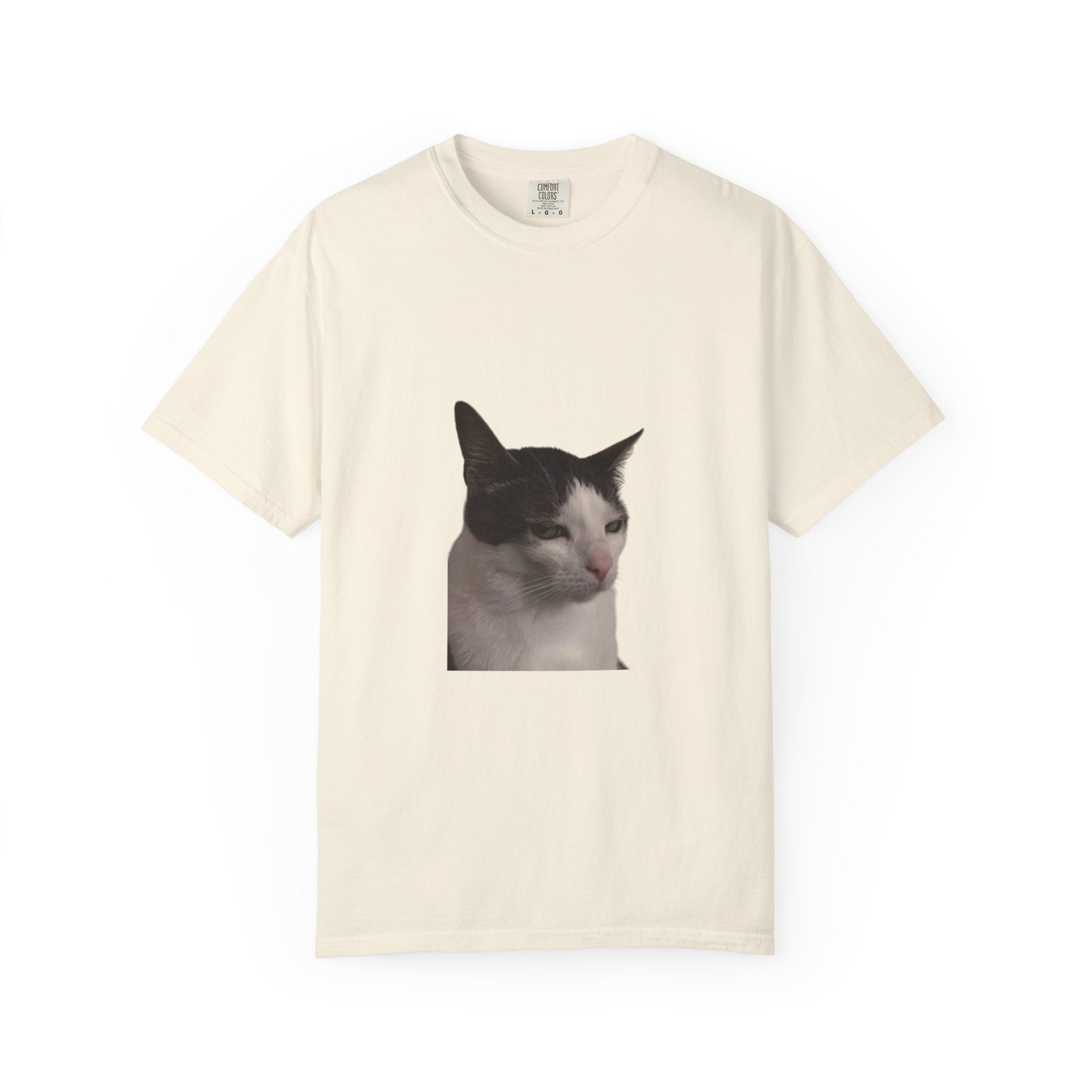 Beige t-shirt with a cat graphic on a white background