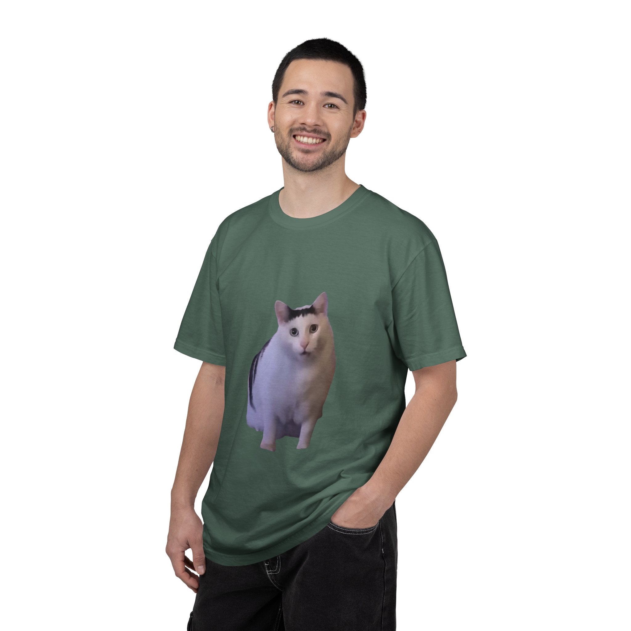 Man wearing a green t-shirt with a cat graphic on a white background