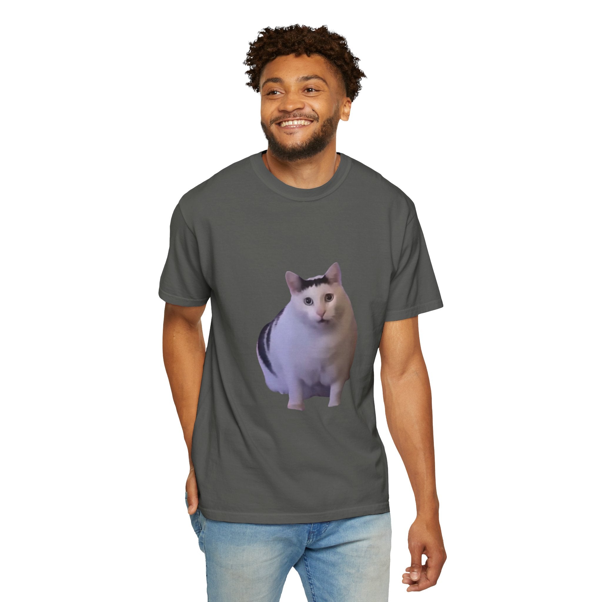 Man wearing a gray t-shirt with a cat graphic on a white background