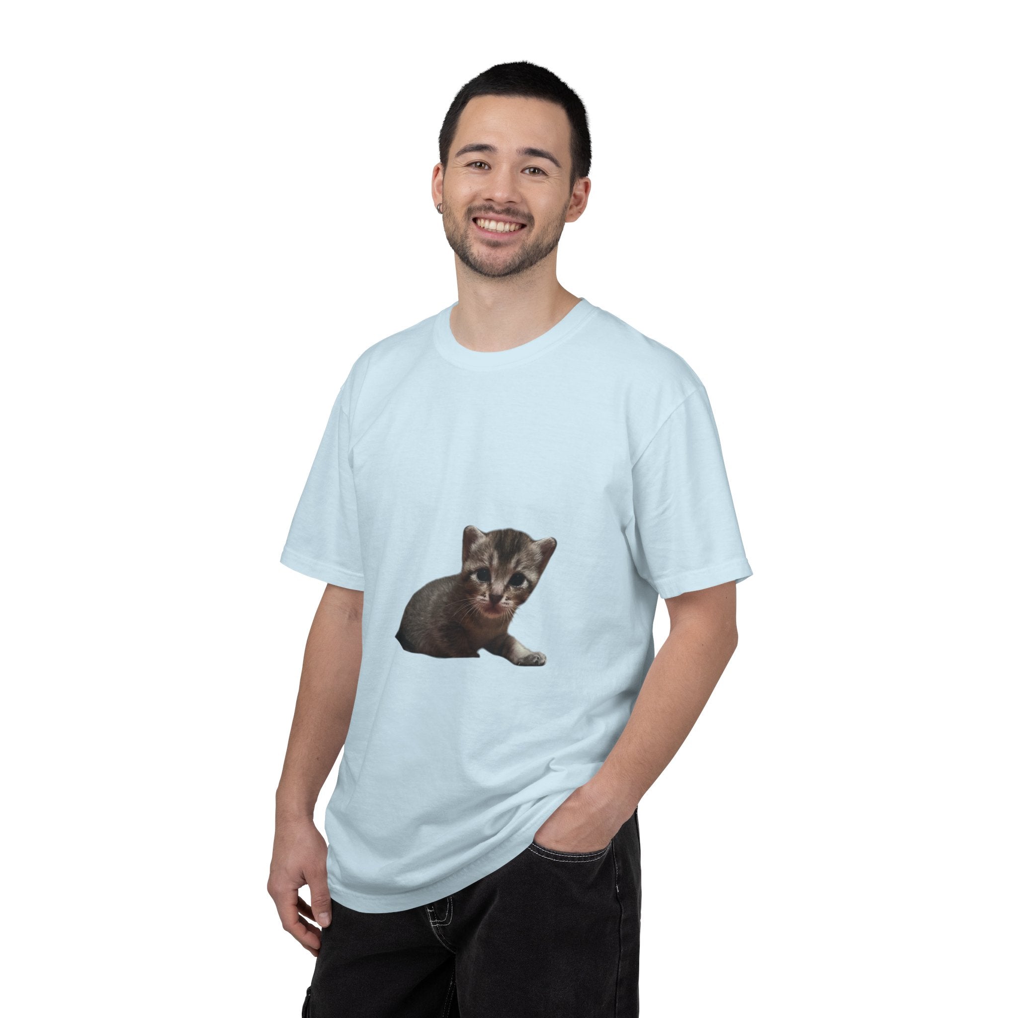 Man wearing a light blue t-shirt with a kitten graphic on a white background