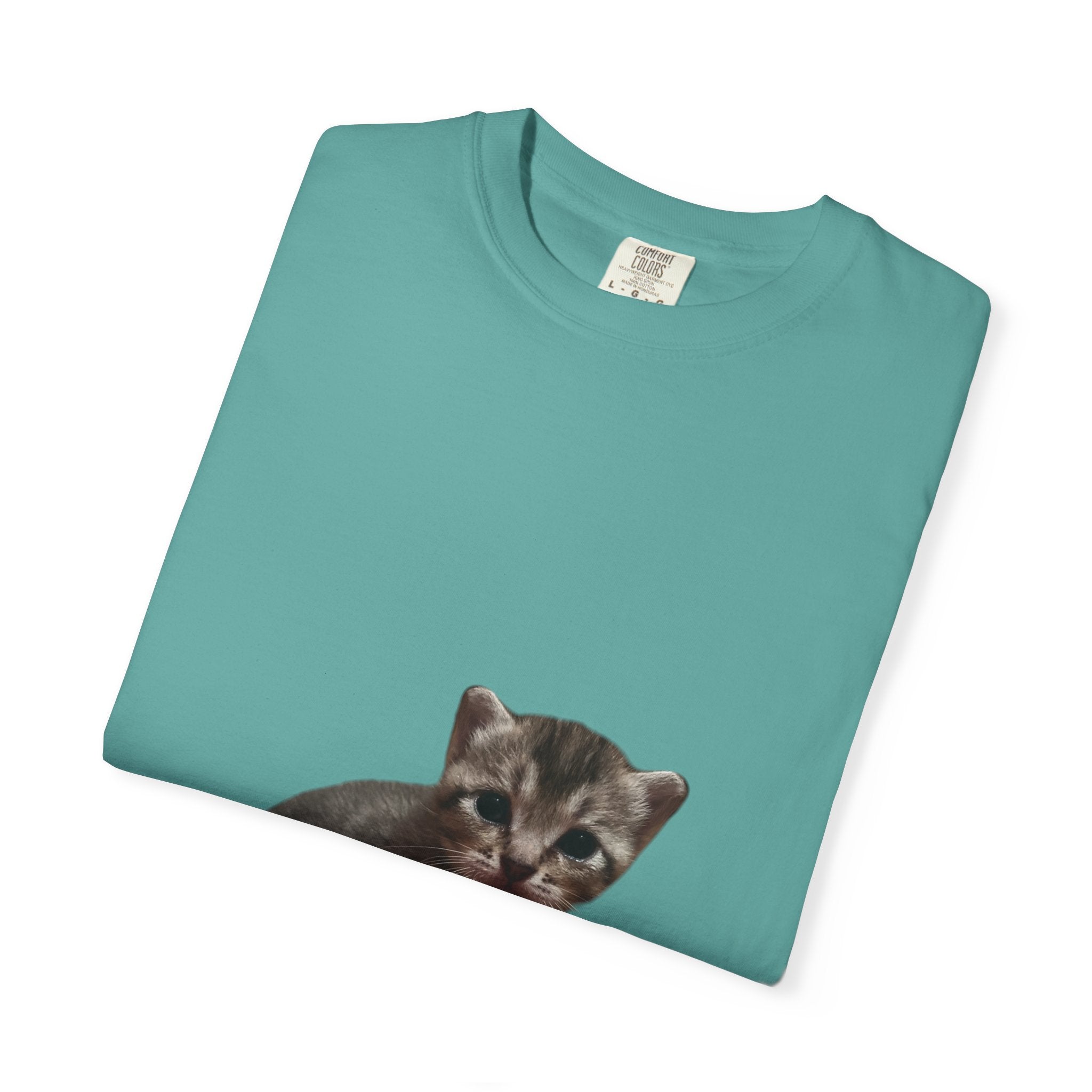 Teal t-shirt with a kitten print on a white background