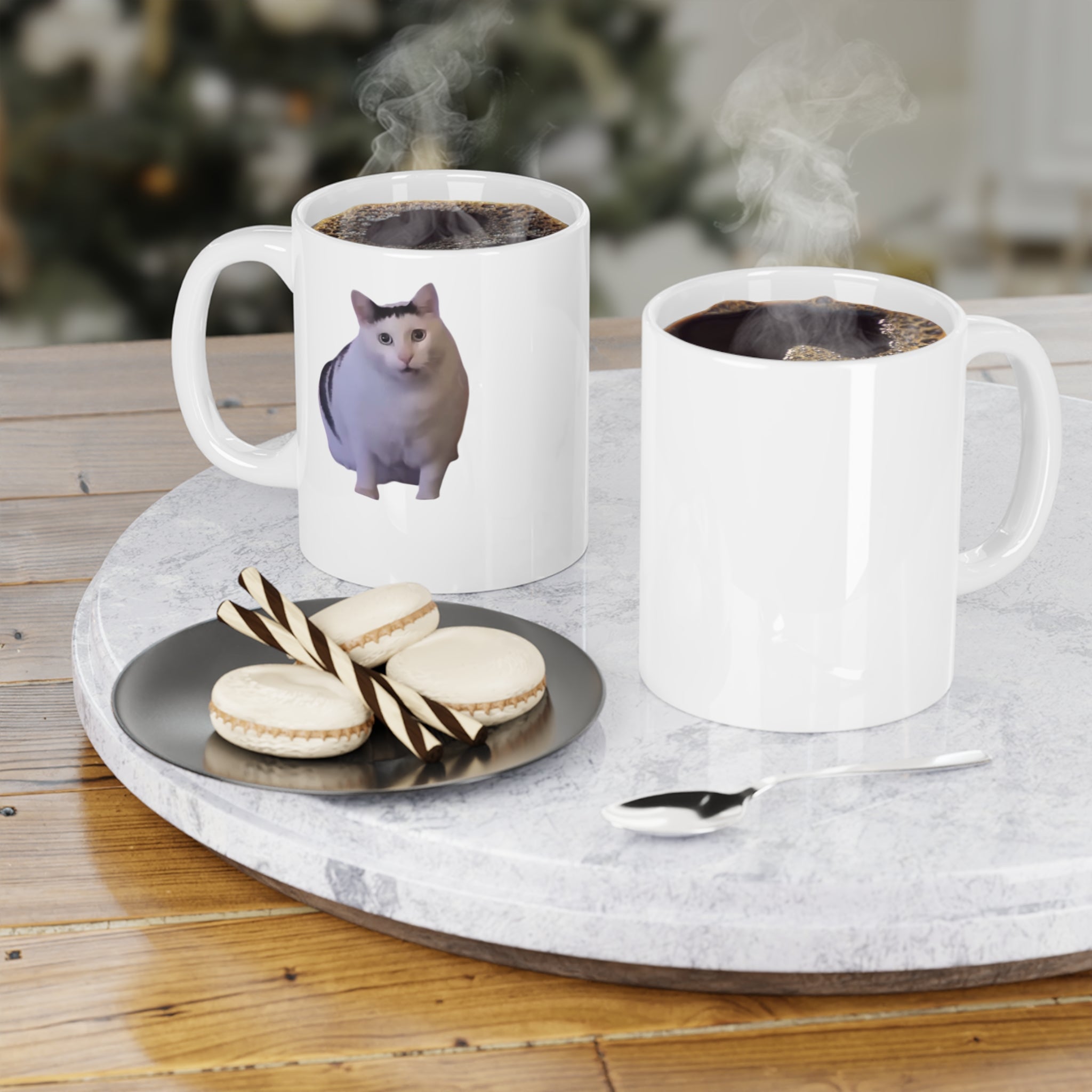 Two mugs with coffee and a cat picture on a marble tray with cookies and a spoon.
