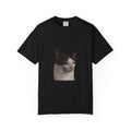 Black t-shirt with a cat's face printed on it against a white background