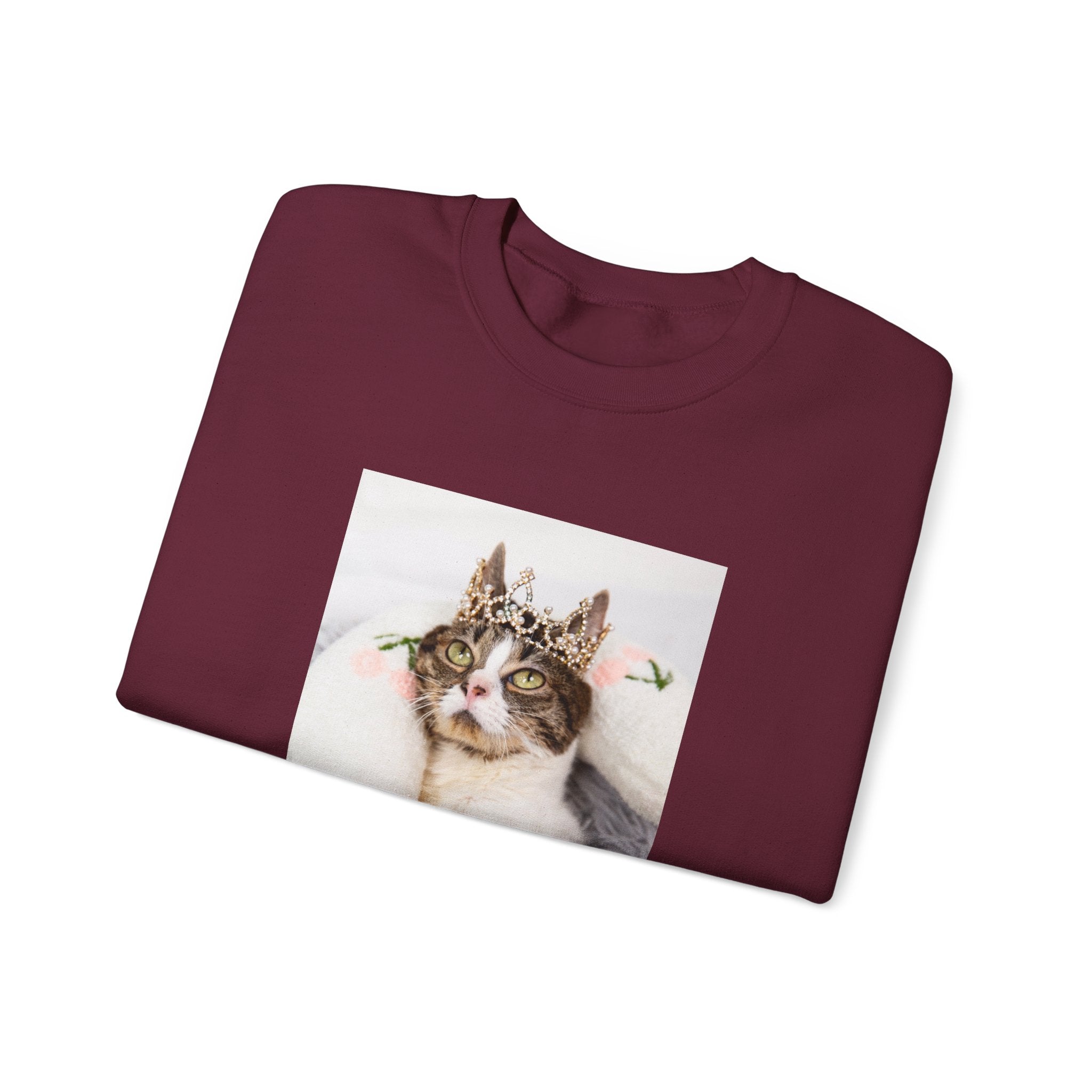 Maroon sweatshirt with a cat wearing a crown graphic on a white background