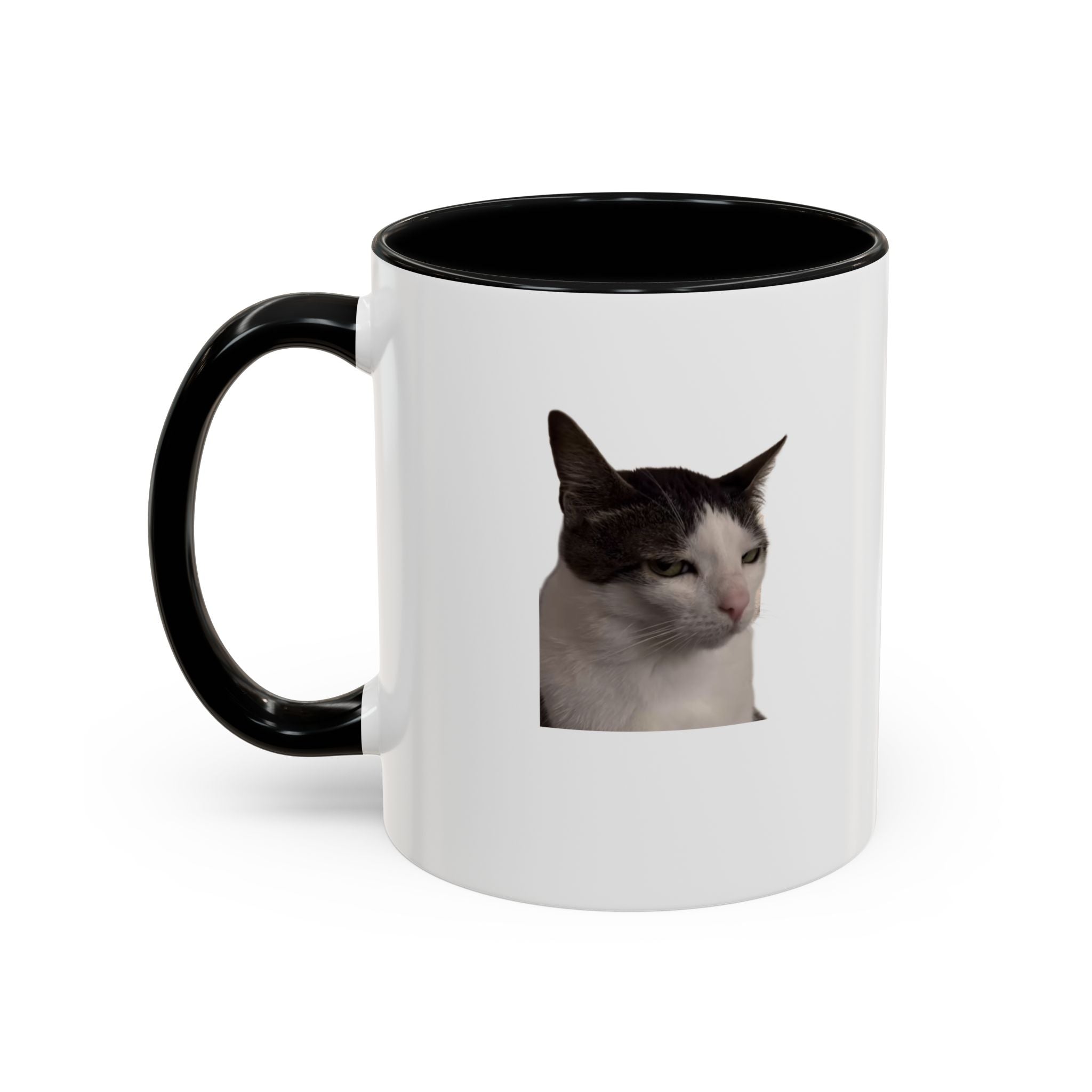 White mug with black handle featuring a cat's face on a white background