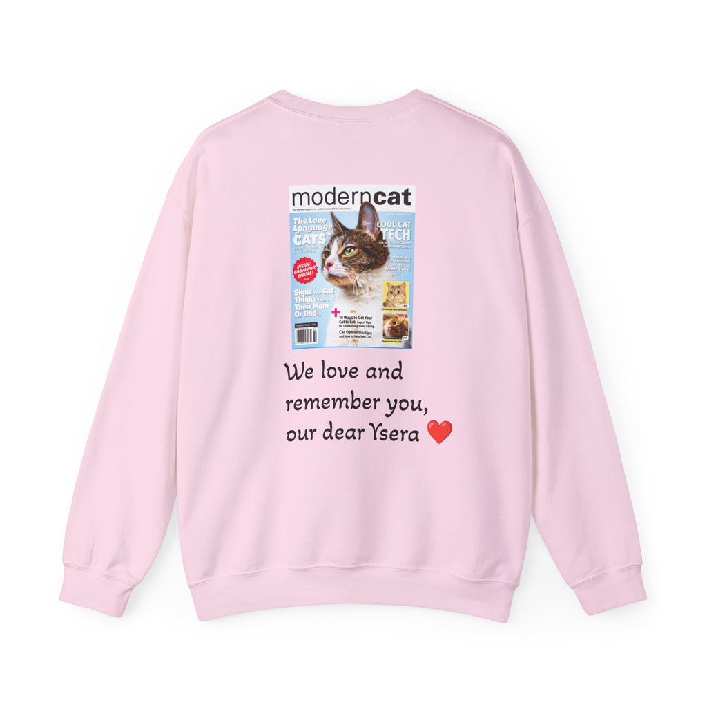 Pink sweatshirt with a printed design of a cat magazine cover and text on a white background