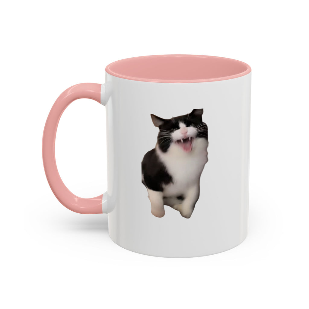 White mug with pink interior and handle featuring a black and white cat design on a white background