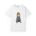 White t-shirt with a graphic of a cat wearing a green hat and blue outfit on a white background