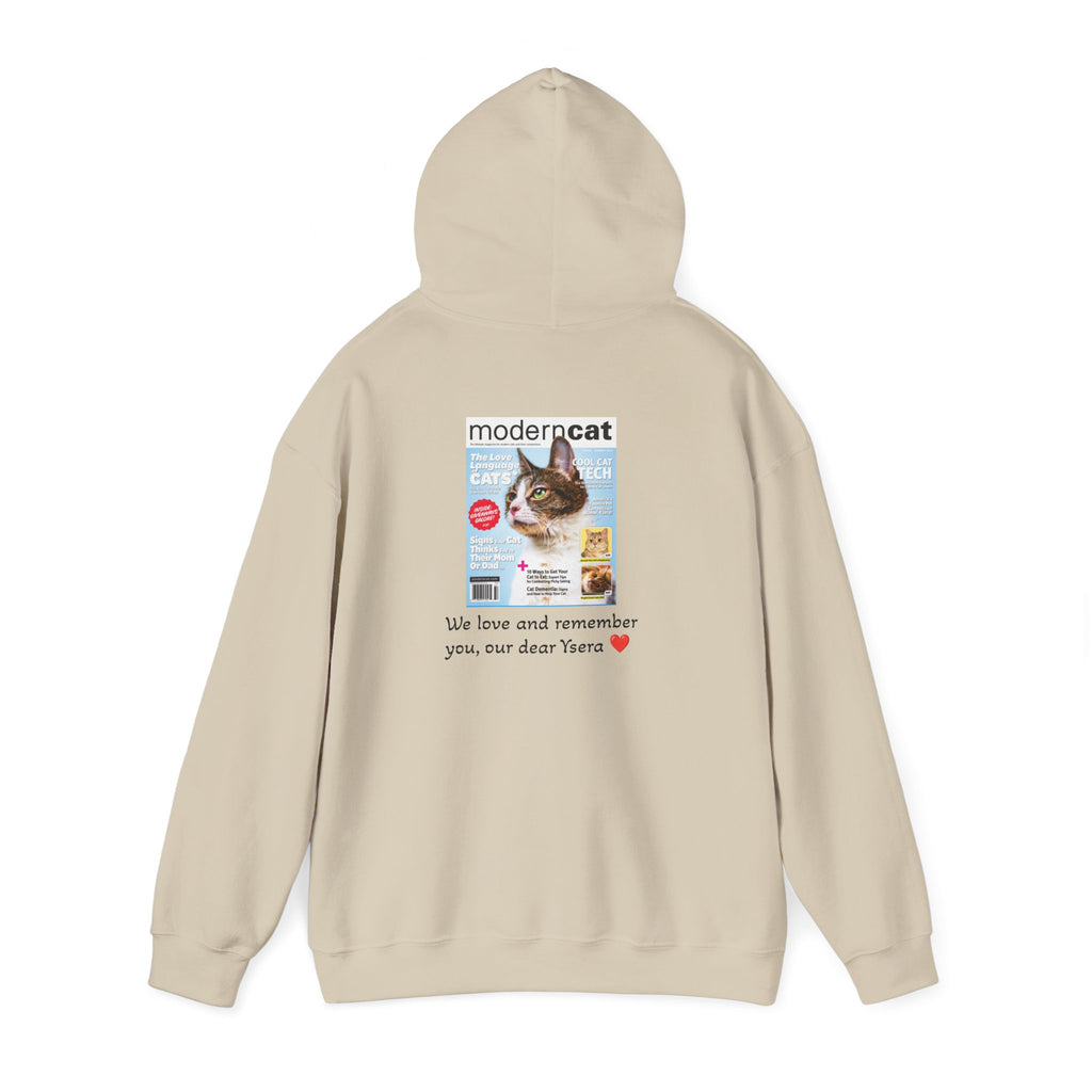 Beige hoodie with a printed design on the chest featuring a cat magazine cover and text.