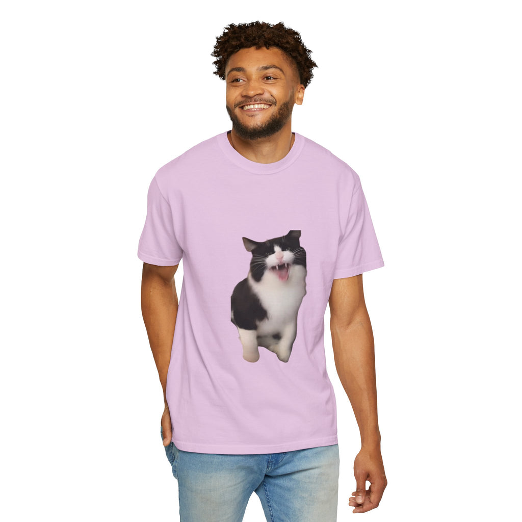 Man wearing a light purple t-shirt with a cat graphic on a white background