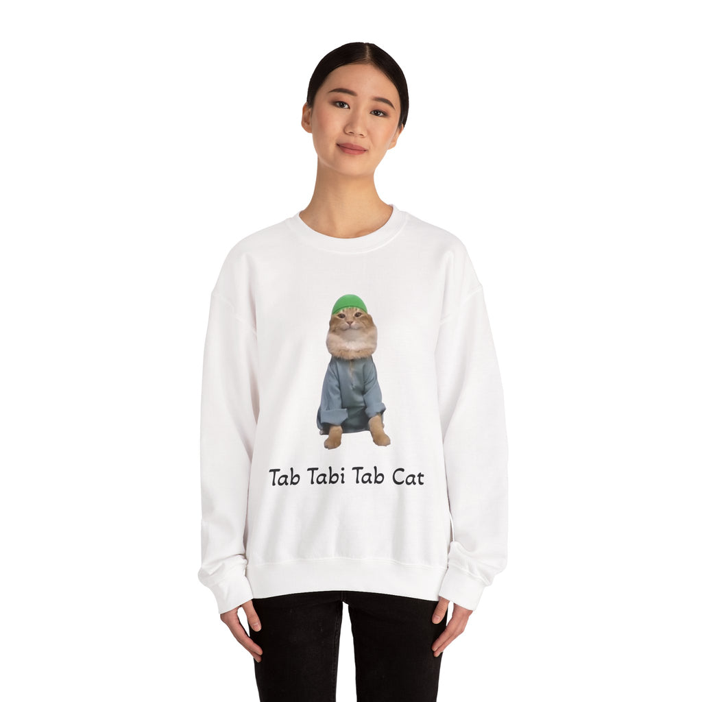 Person wearing a white sweatshirt with a cat graphic and text on a white background