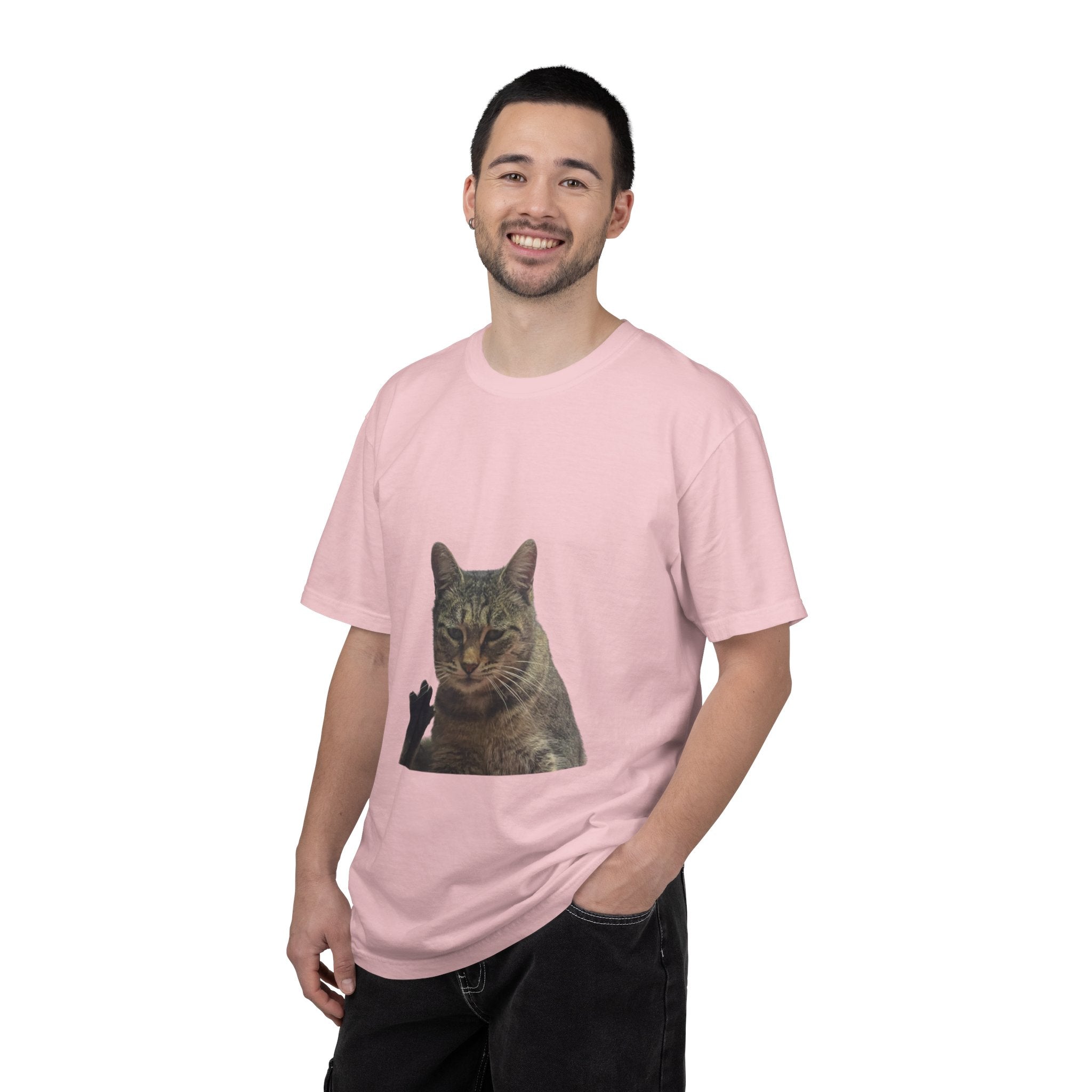 Man wearing a pink t-shirt with a cat graphic on a white background
