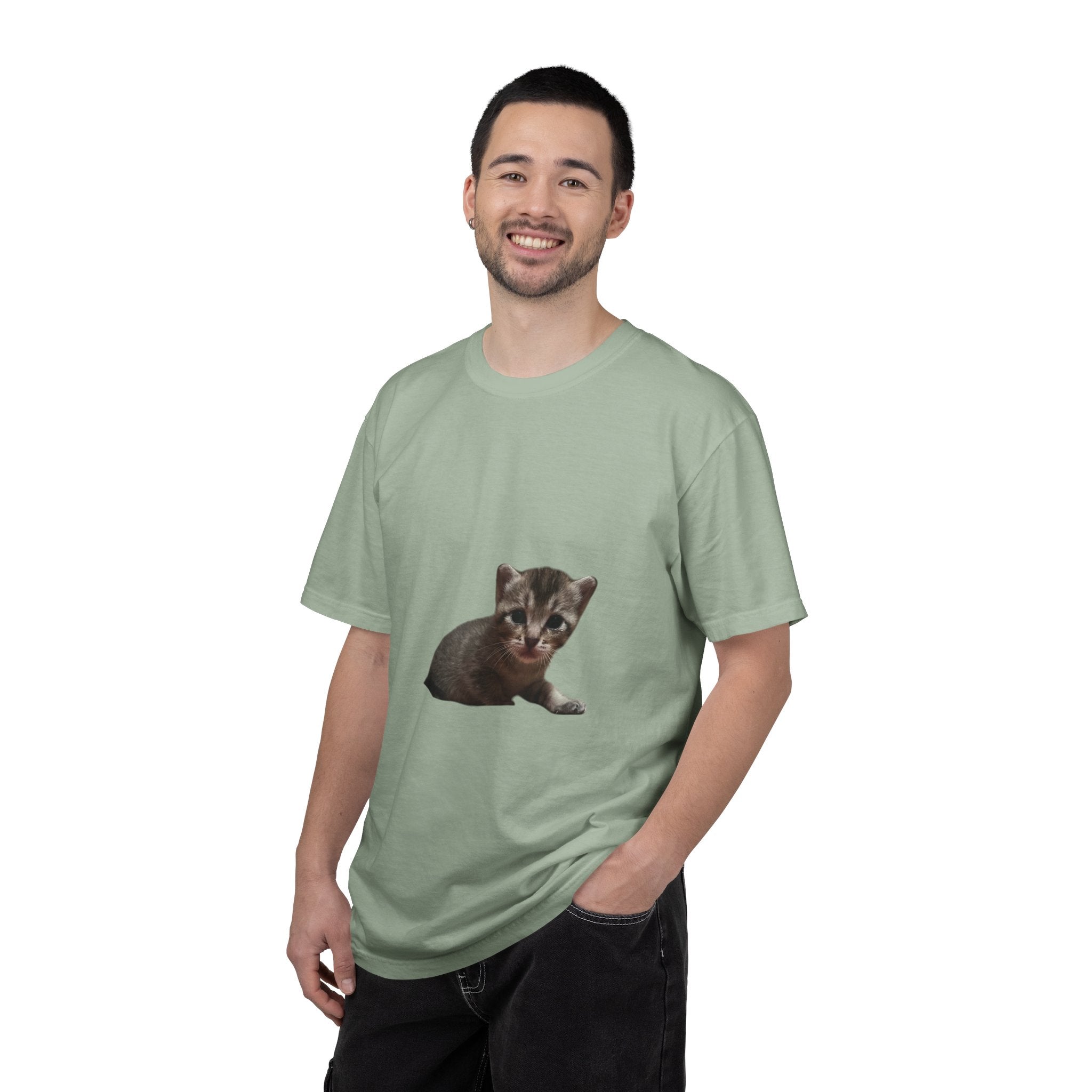 Man wearing a cream t-shirt with a kitten graphic on a white background