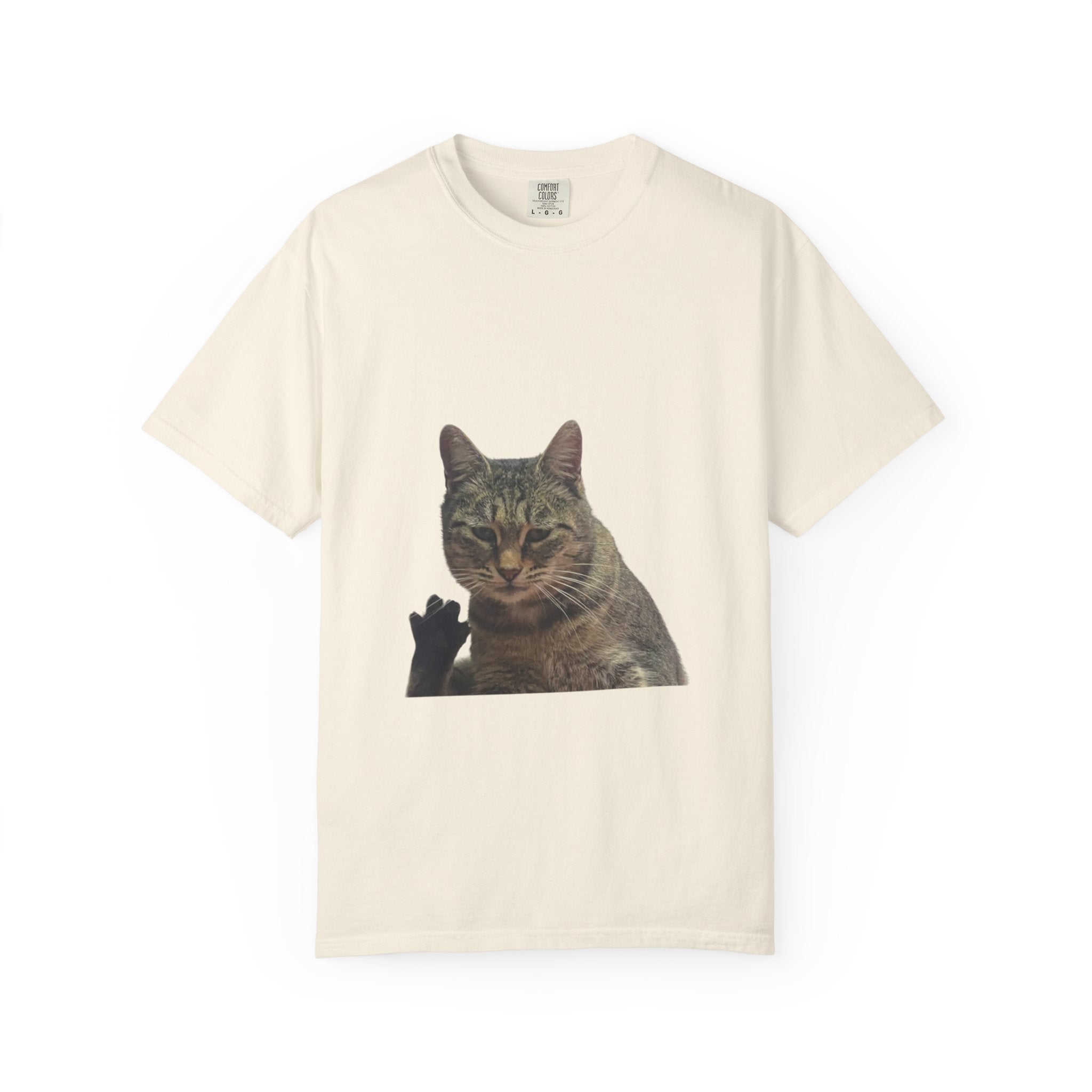 Beige t-shirt with a cat graphic on a white background