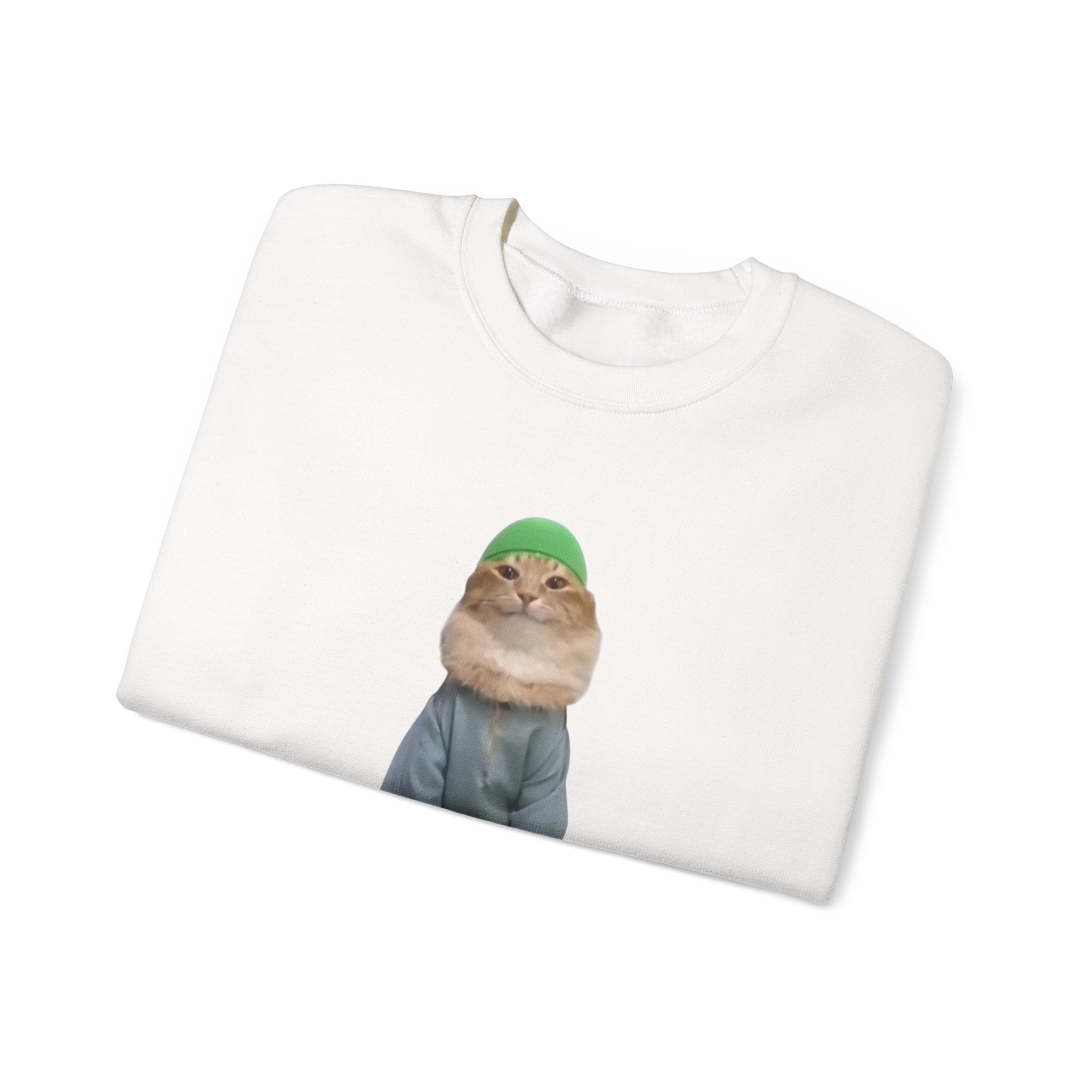White t-shirt with a printed design of a cat wearing a green beanie on a white background