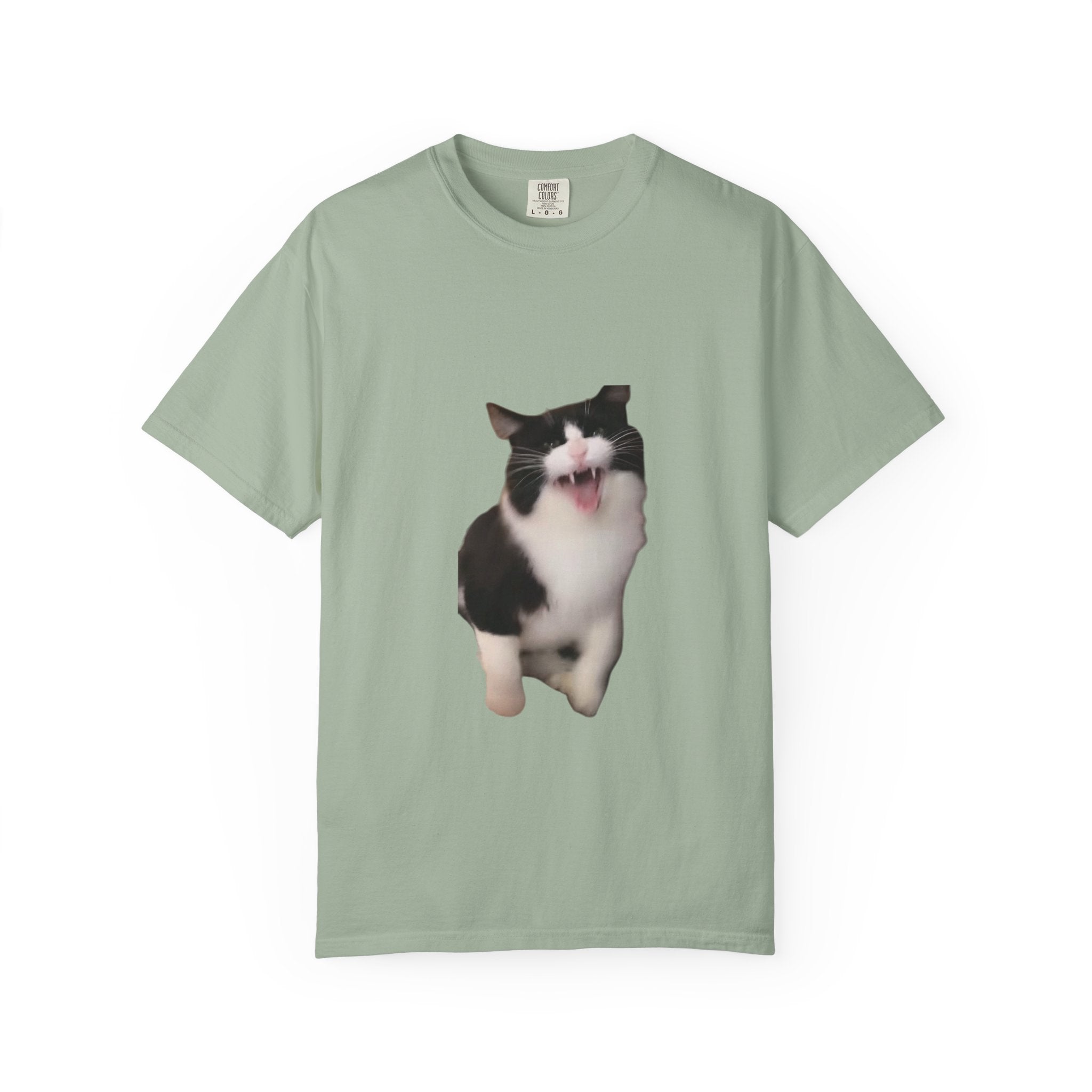 Light green t-shirt with a black and white cat graphic on a white background