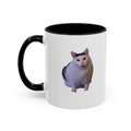 White mug with black handle featuring a cat design on a white background