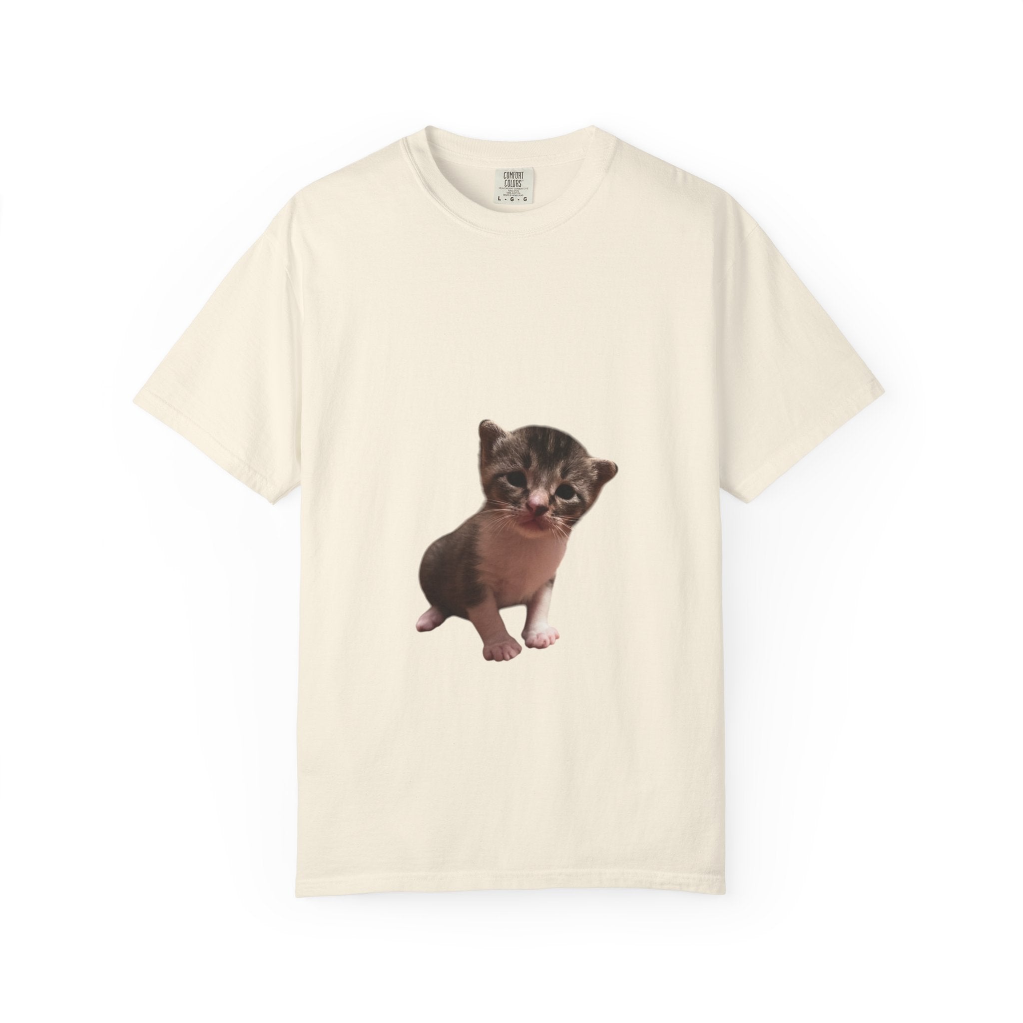 Beige t-shirt with a kitten graphic on a white background