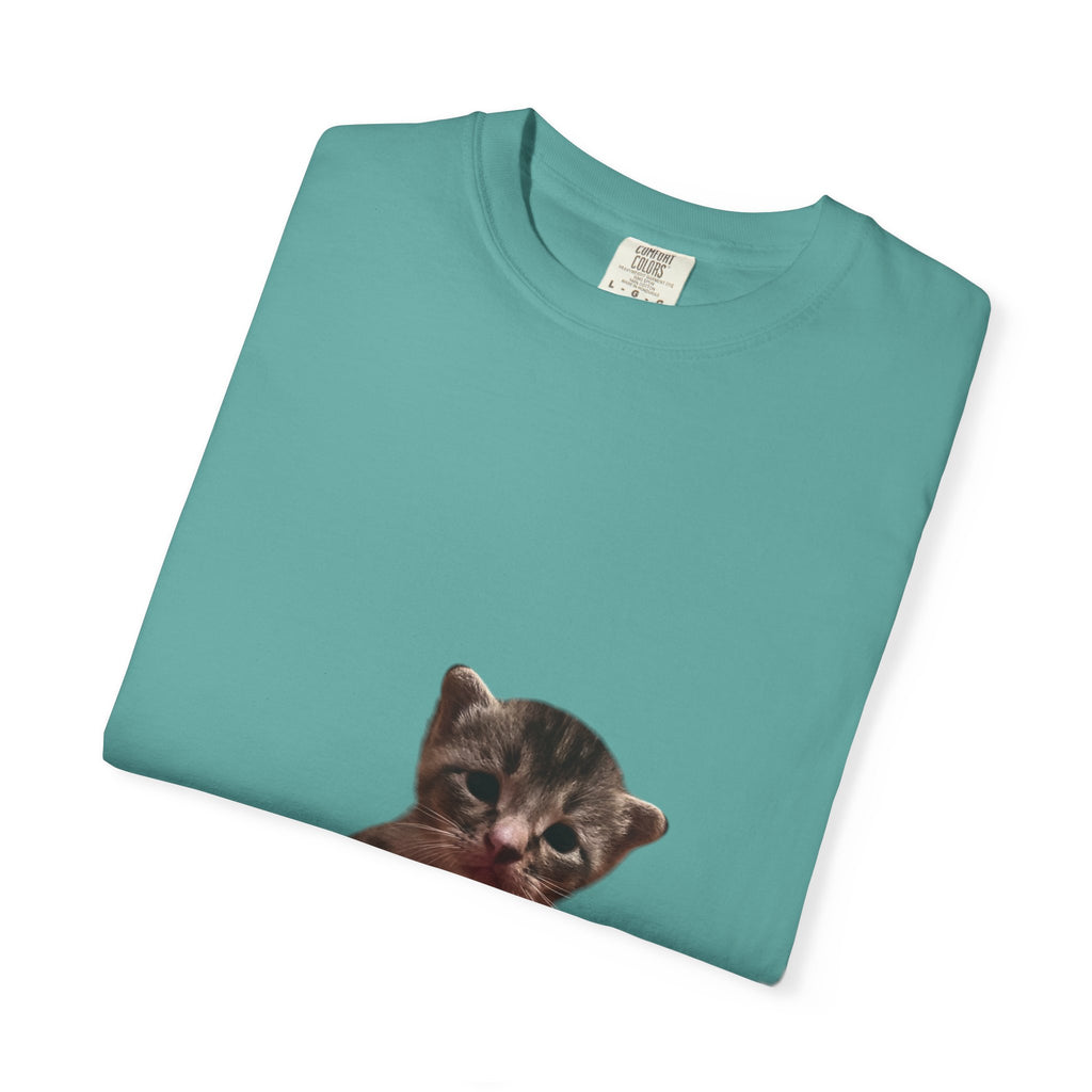 Teal t-shirt with a printed cat face on a white background