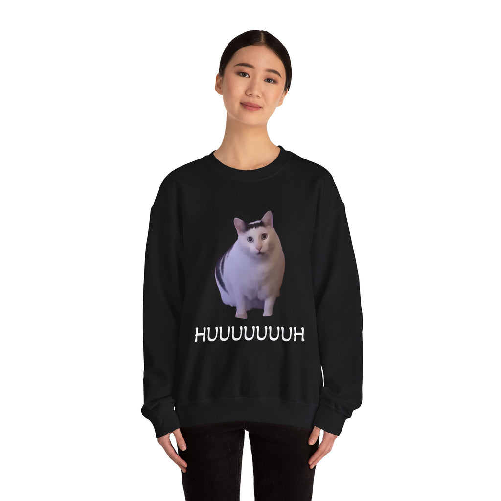 Person wearing a black sweatshirt with a cat graphic and text on a white background