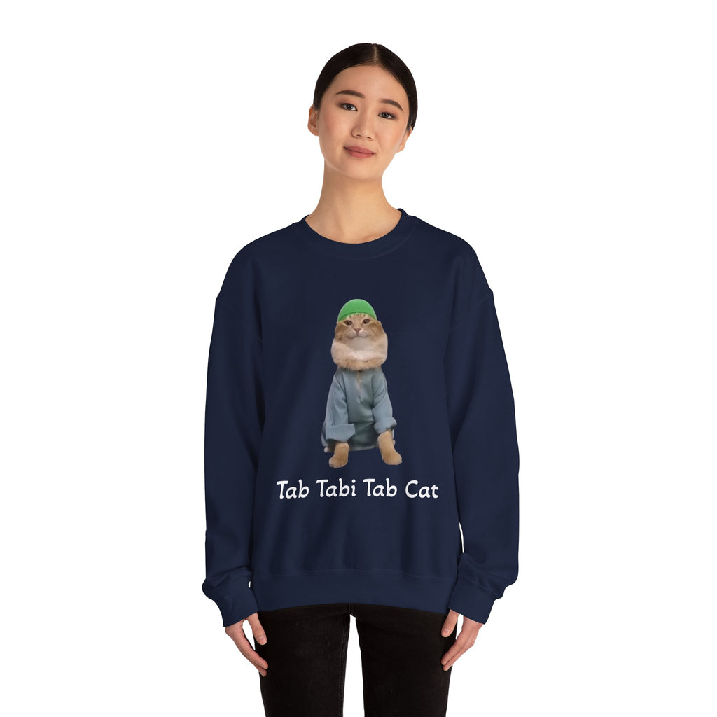 Person wearing a navy blue sweatshirt with a cat graphic and text on a white background