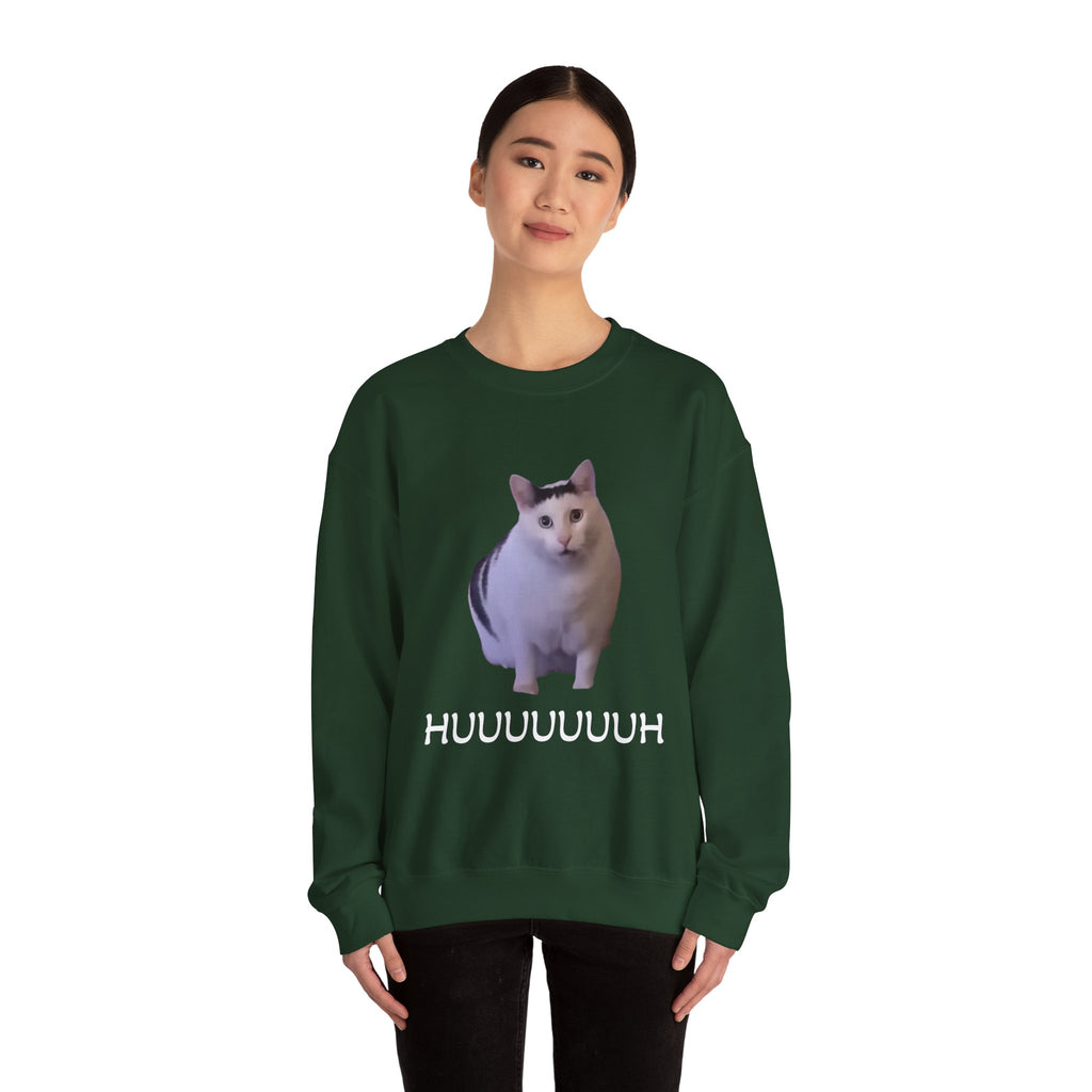 Person wearing a green sweatshirt with a cat graphic and text on a white background