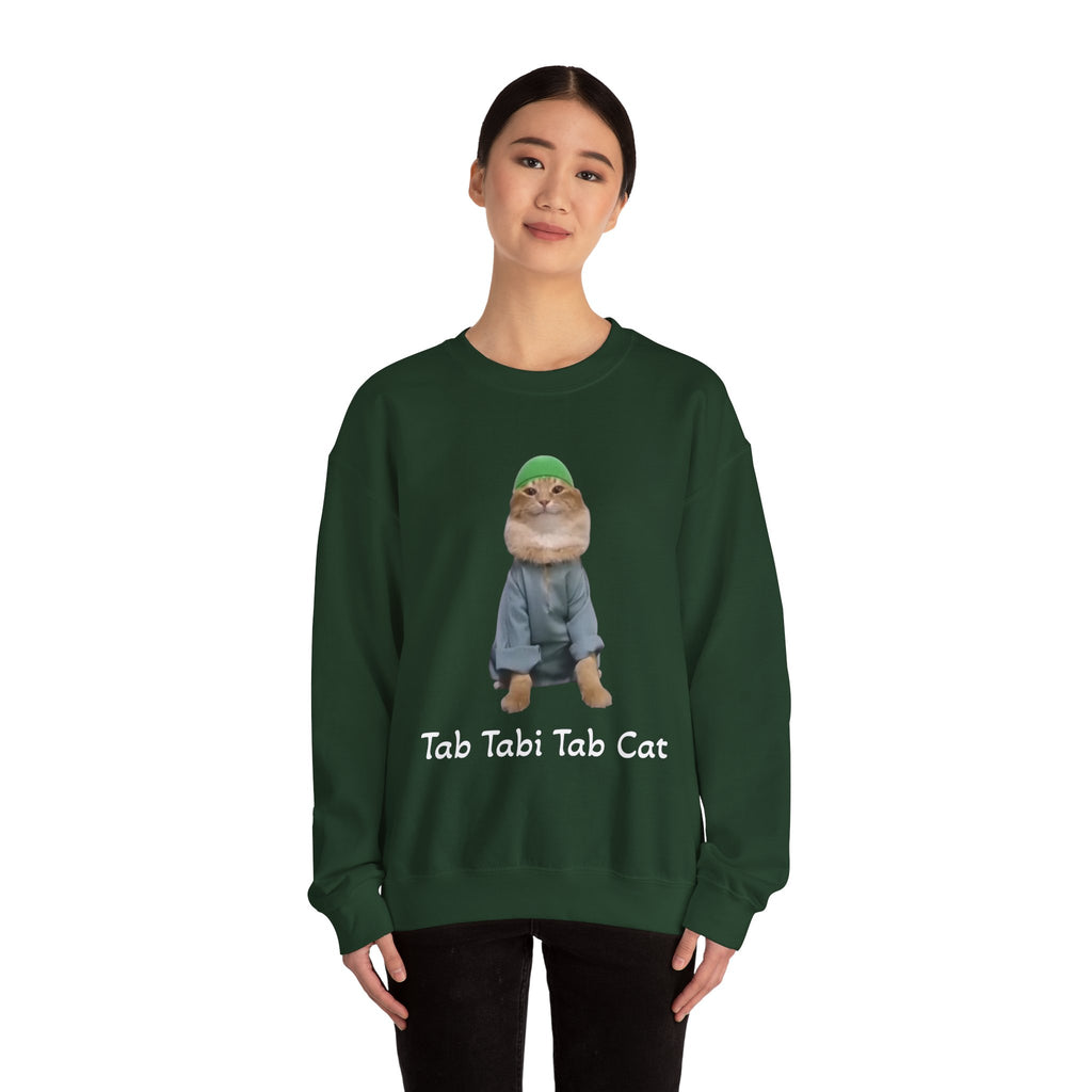 Person wearing a green sweatshirt with a cat graphic and text on a white background