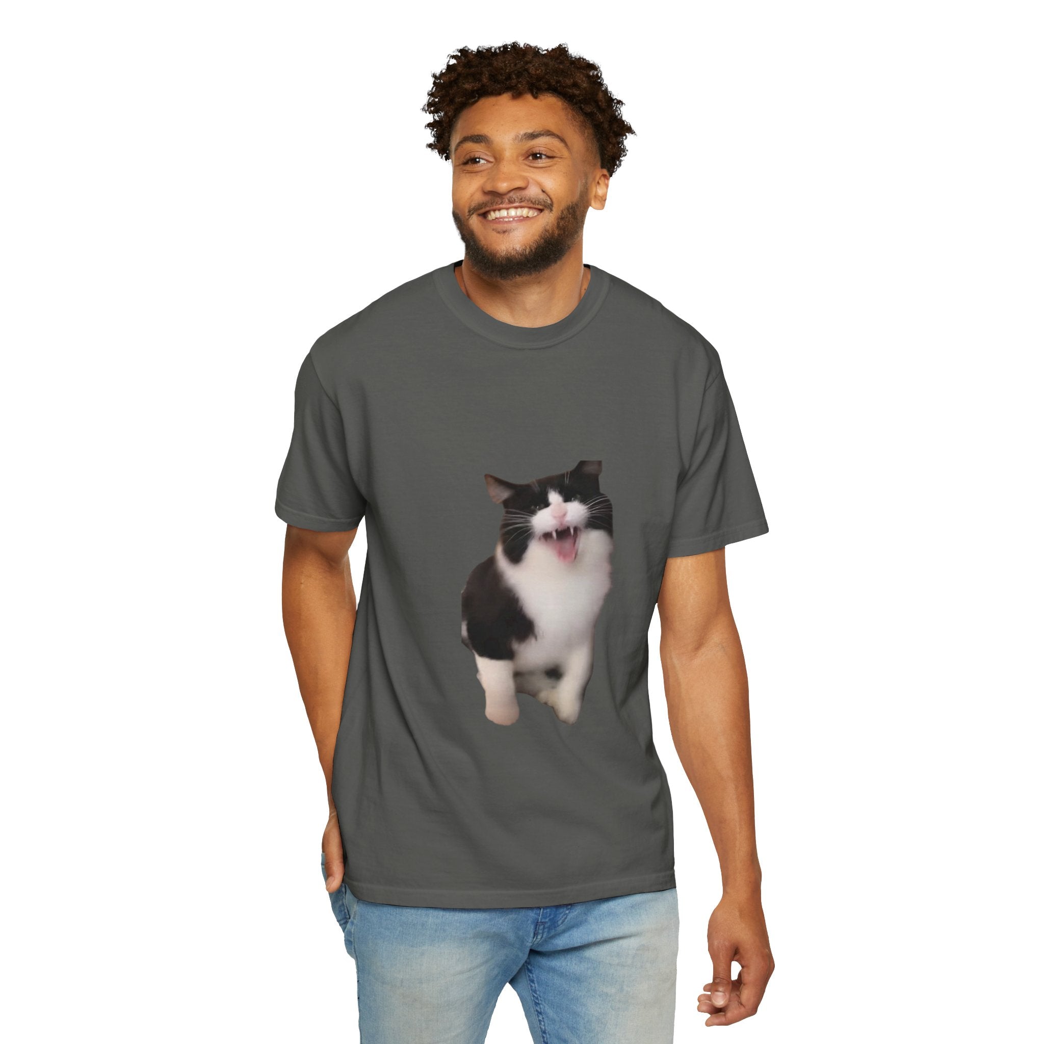 Man wearing a gray t-shirt with a cat graphic on a white background