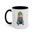 Mug with a cat wearing a green beanie and gray outfit on a white background
