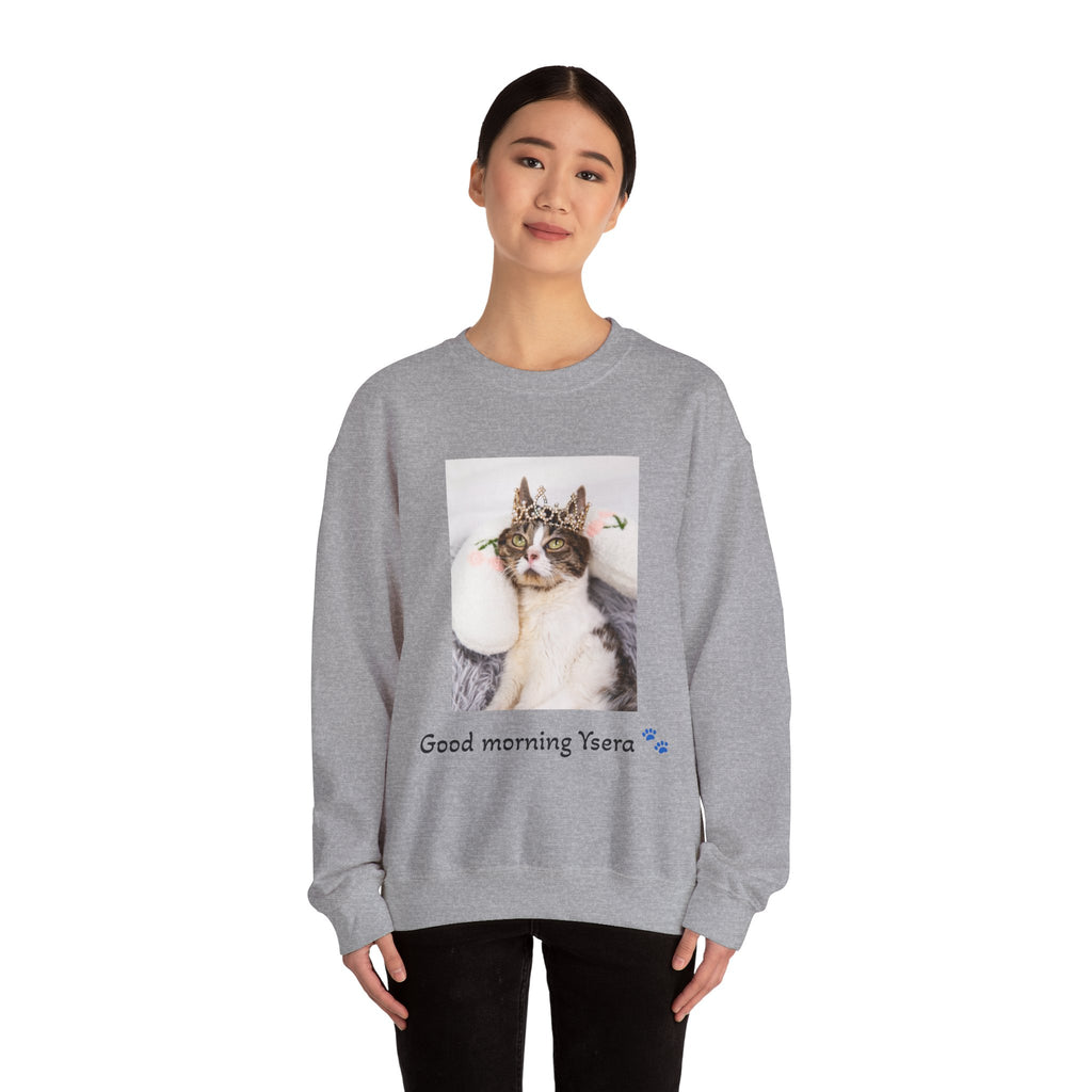 Person wearing a gray sweatshirt with a cat graphic and text on a white background