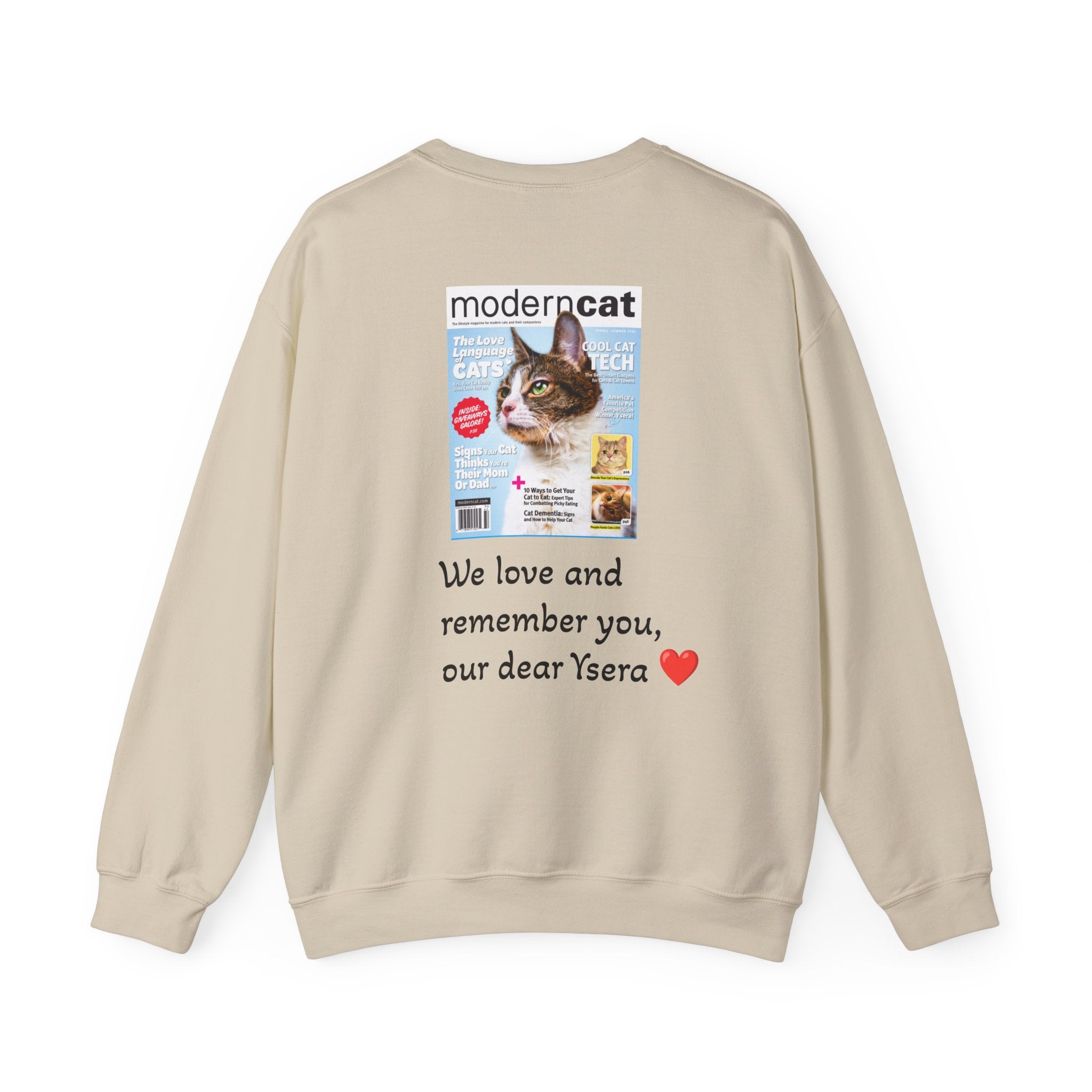 Beige sweatshirt with a magazine cover and text on the back, on a white background