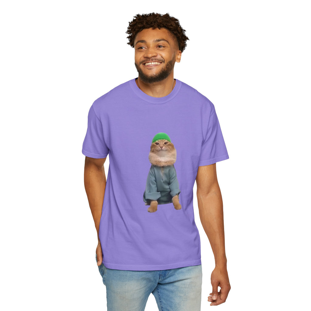 Man wearing a purple t-shirt with a graphic of a small animal in a green hat and coat on a white background