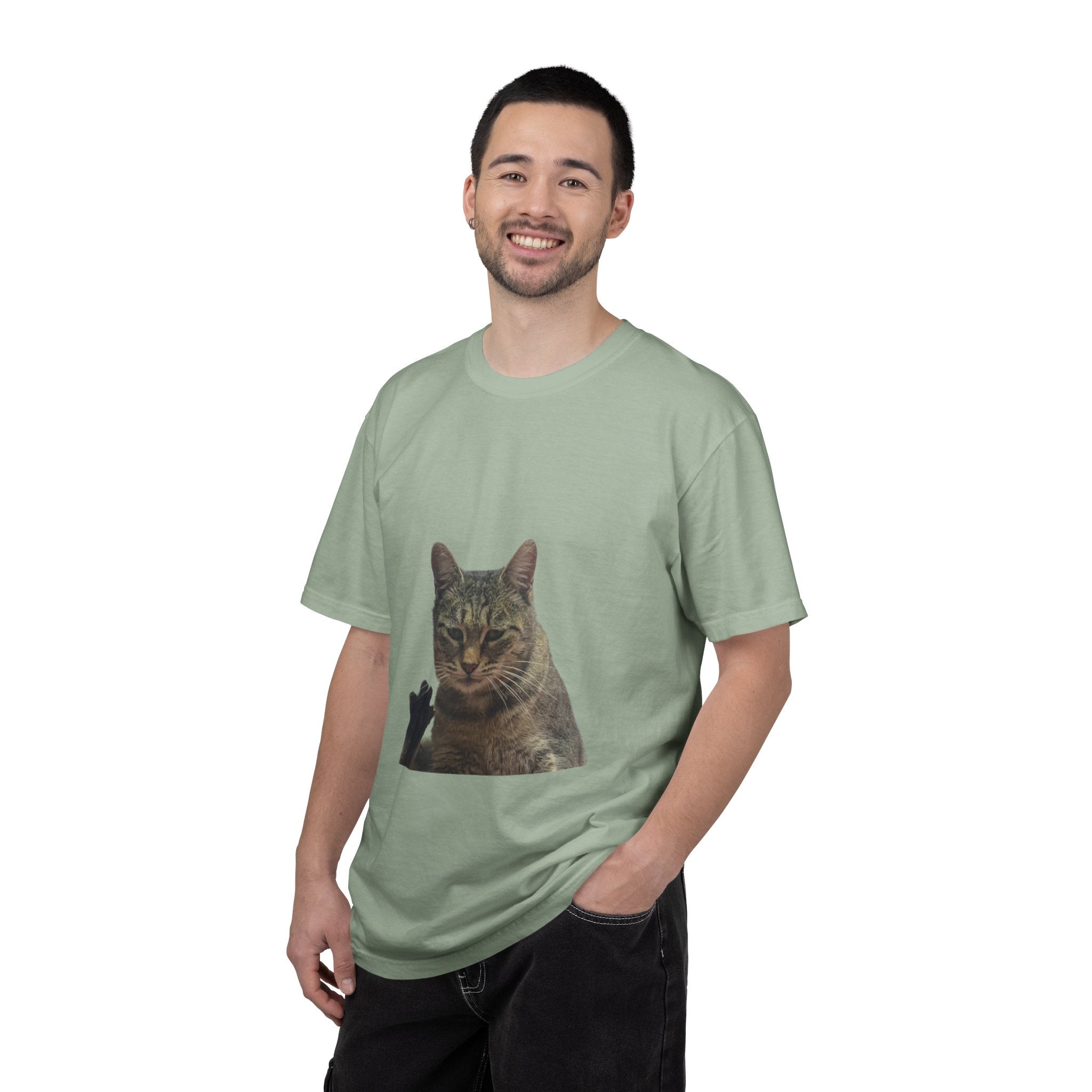 Man wearing a light green t-shirt with a cat print on a white background