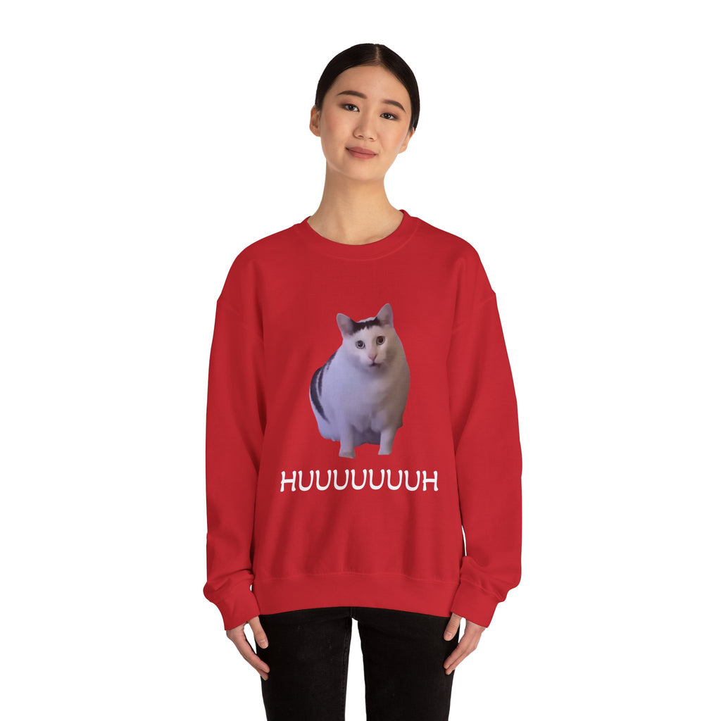 Person wearing a red sweatshirt with a cat graphic and text on a white background