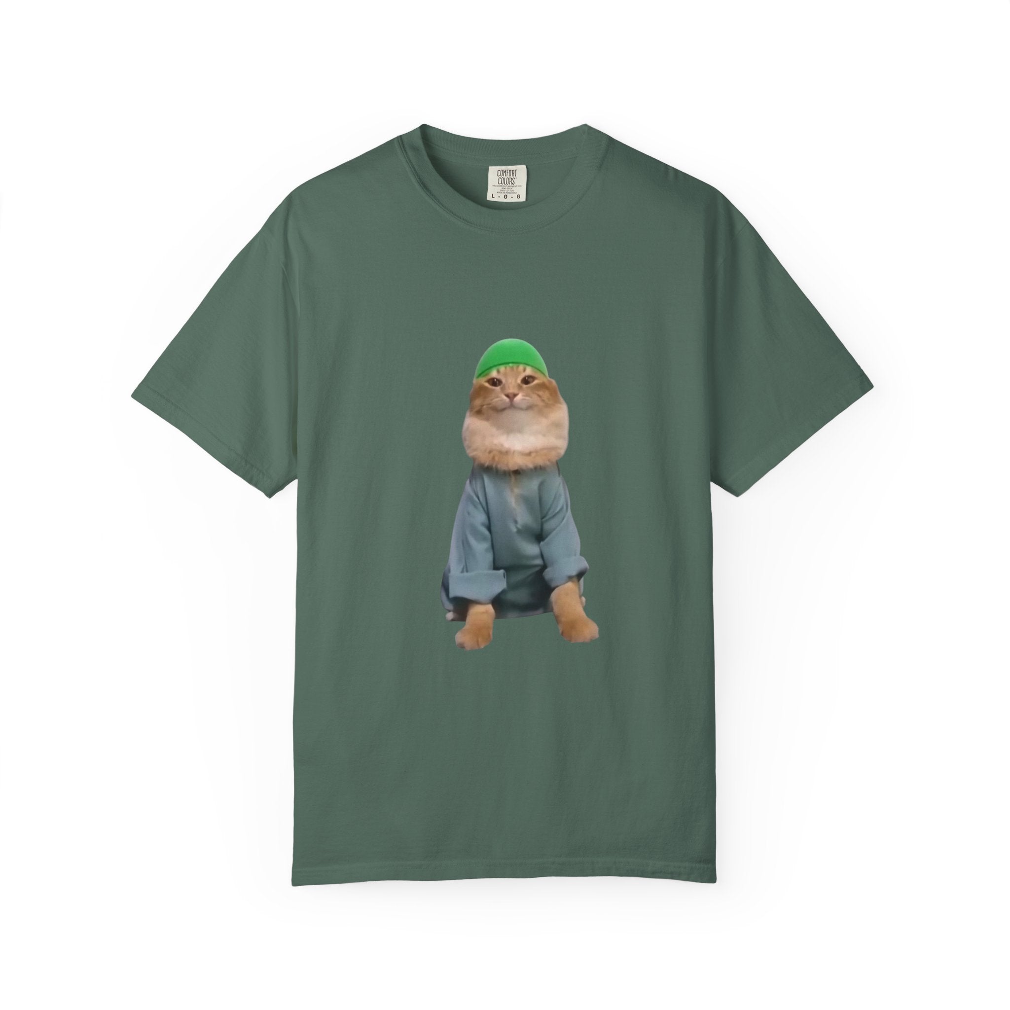 Green t-shirt with a graphic of a cat wearing a green hat and blue jacket on a white background