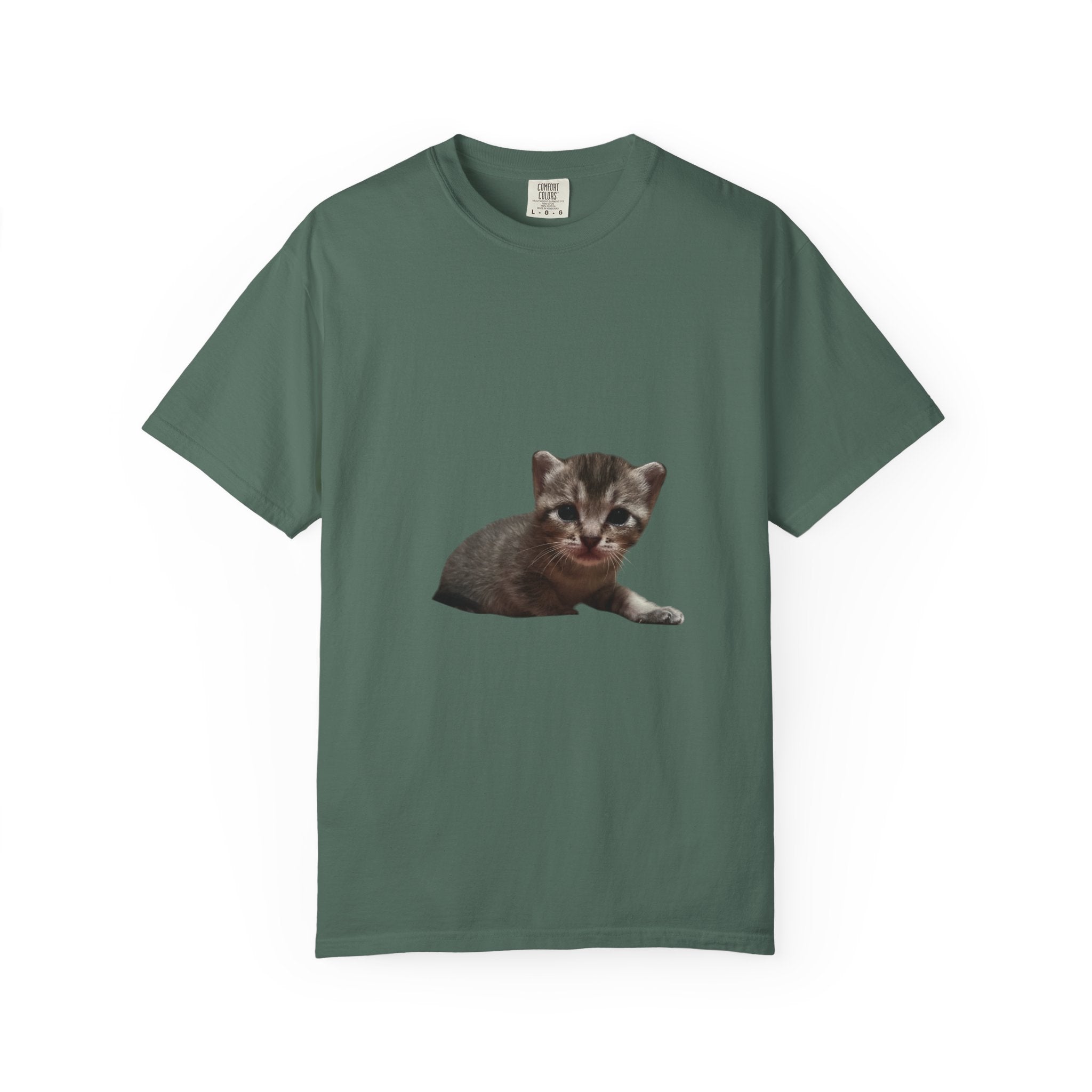 Green t-shirt with a kitten graphic on a white background