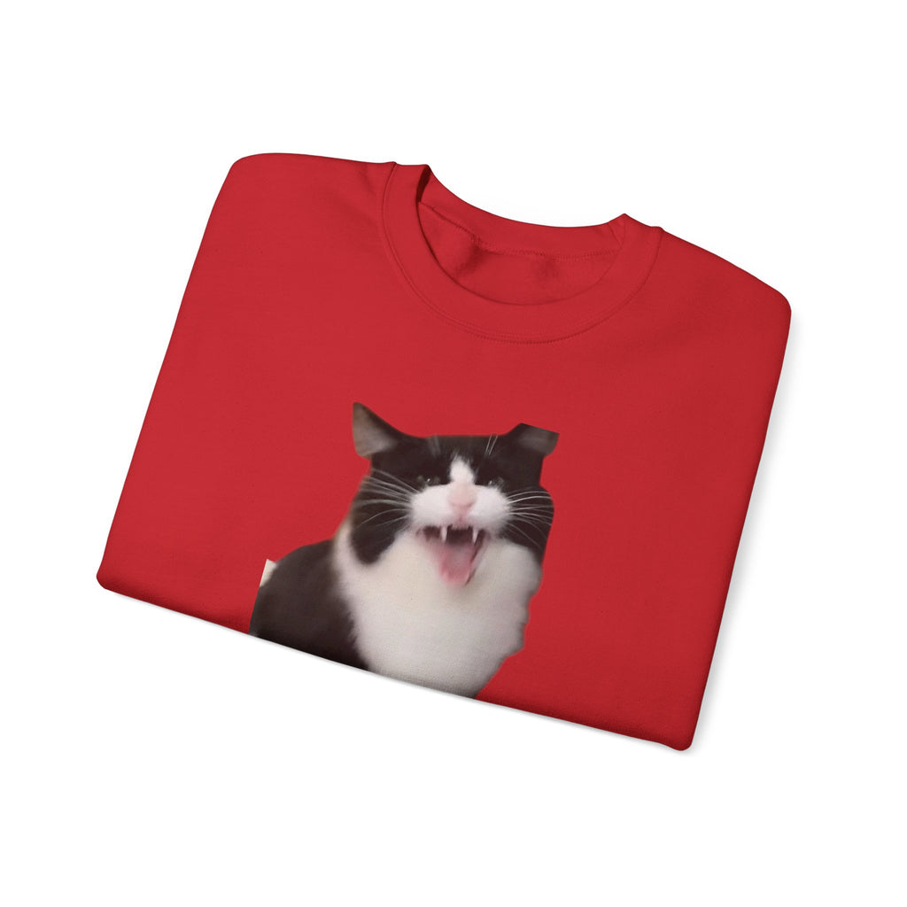 Folded red t-shirt with a black and white cat graphic on a white background