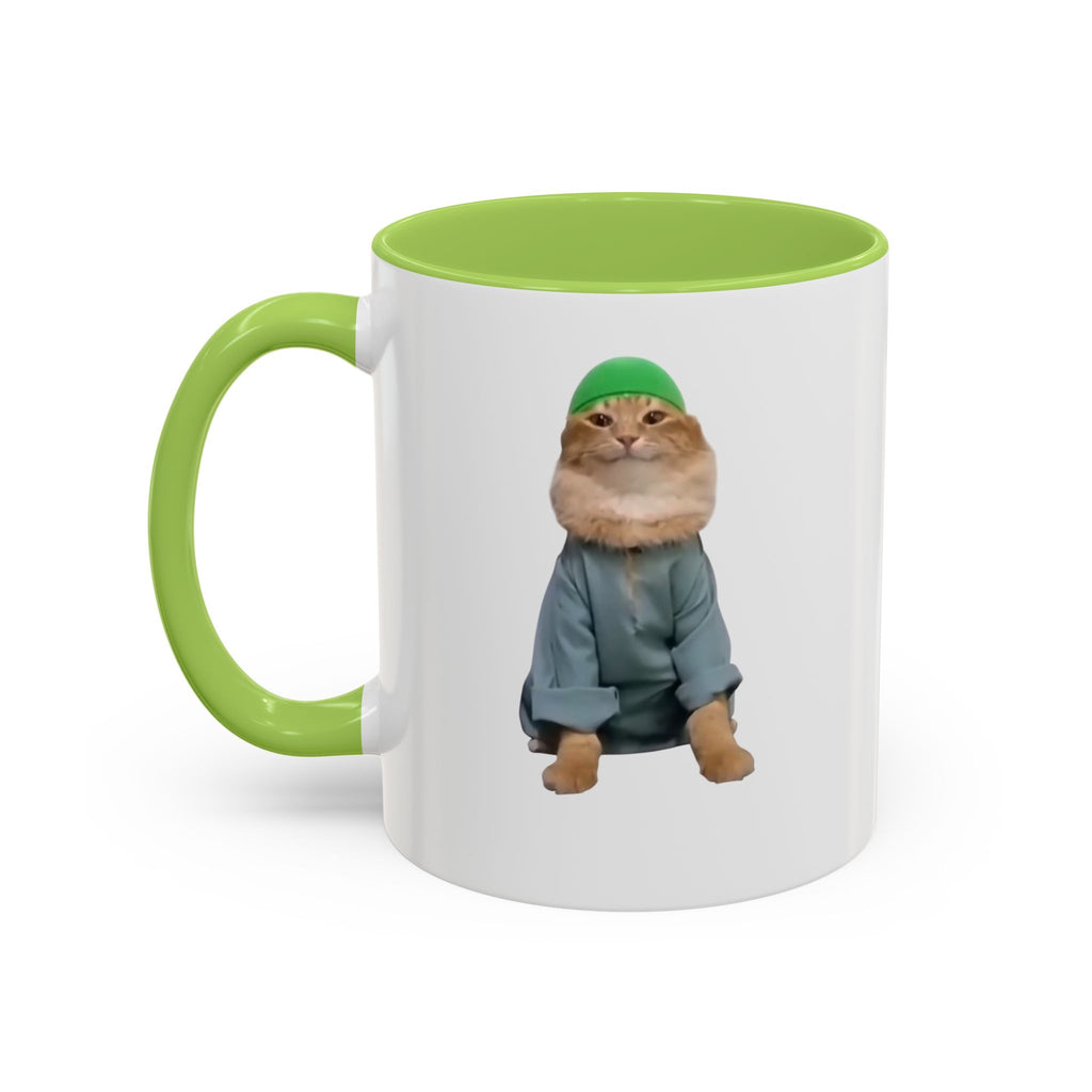 Mug with a cat wearing a green hat and coat on a white background