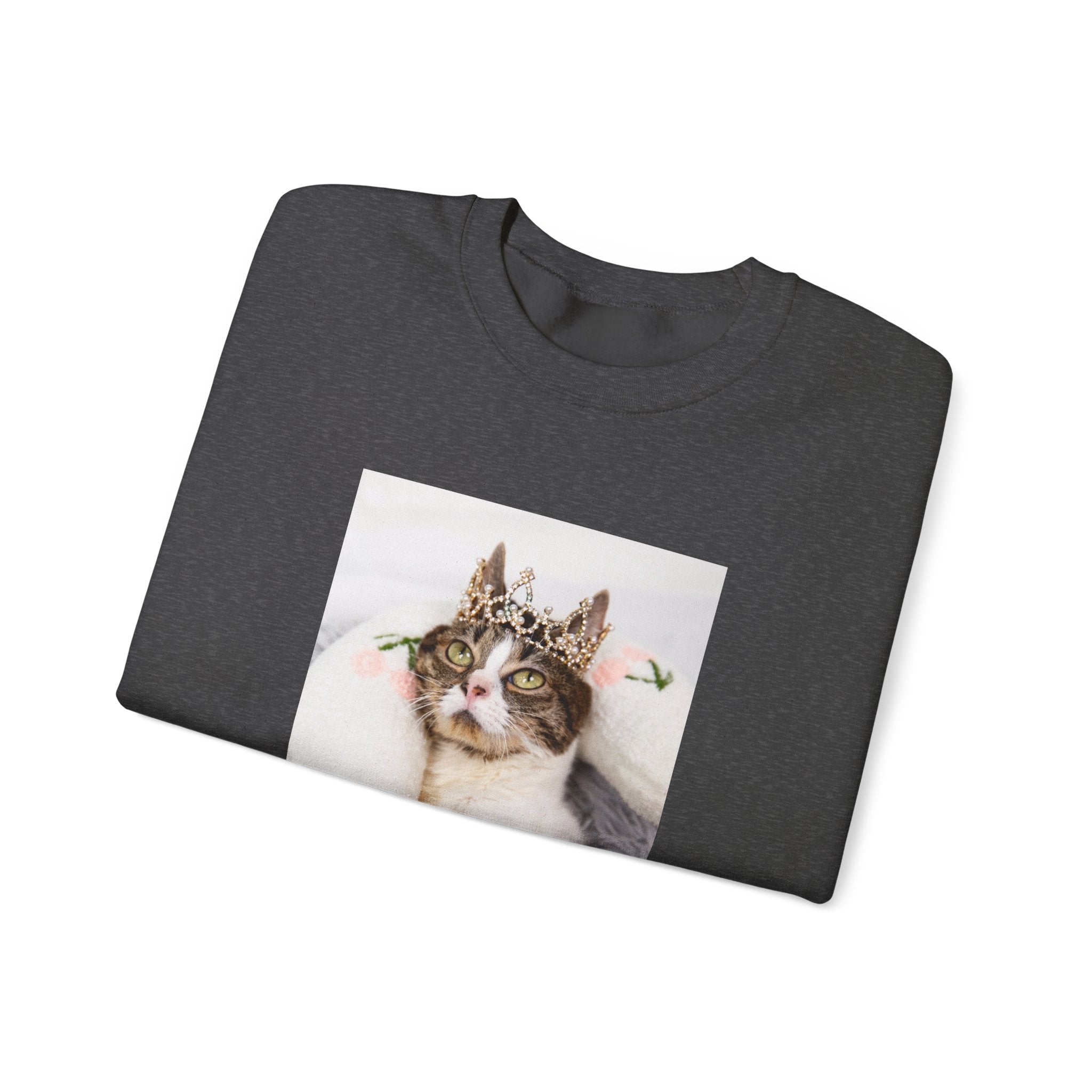 Folded dark gray sweatshirt with a cat wearing a crown graphic on a white background