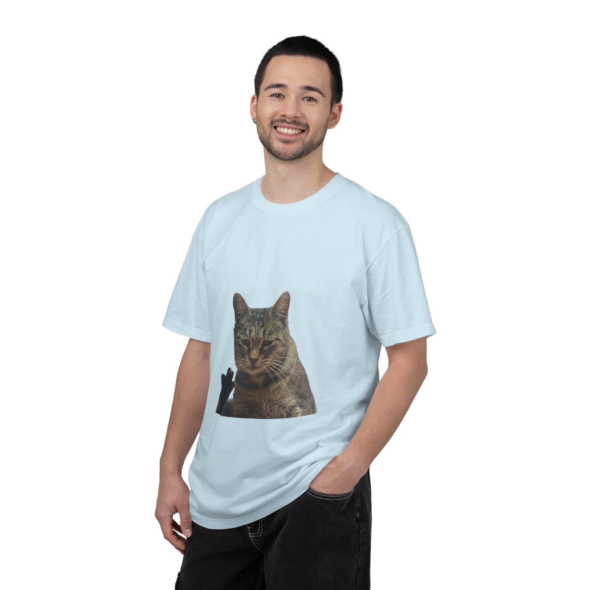 Man wearing a light blue t-shirt with a cat graphic on a white background