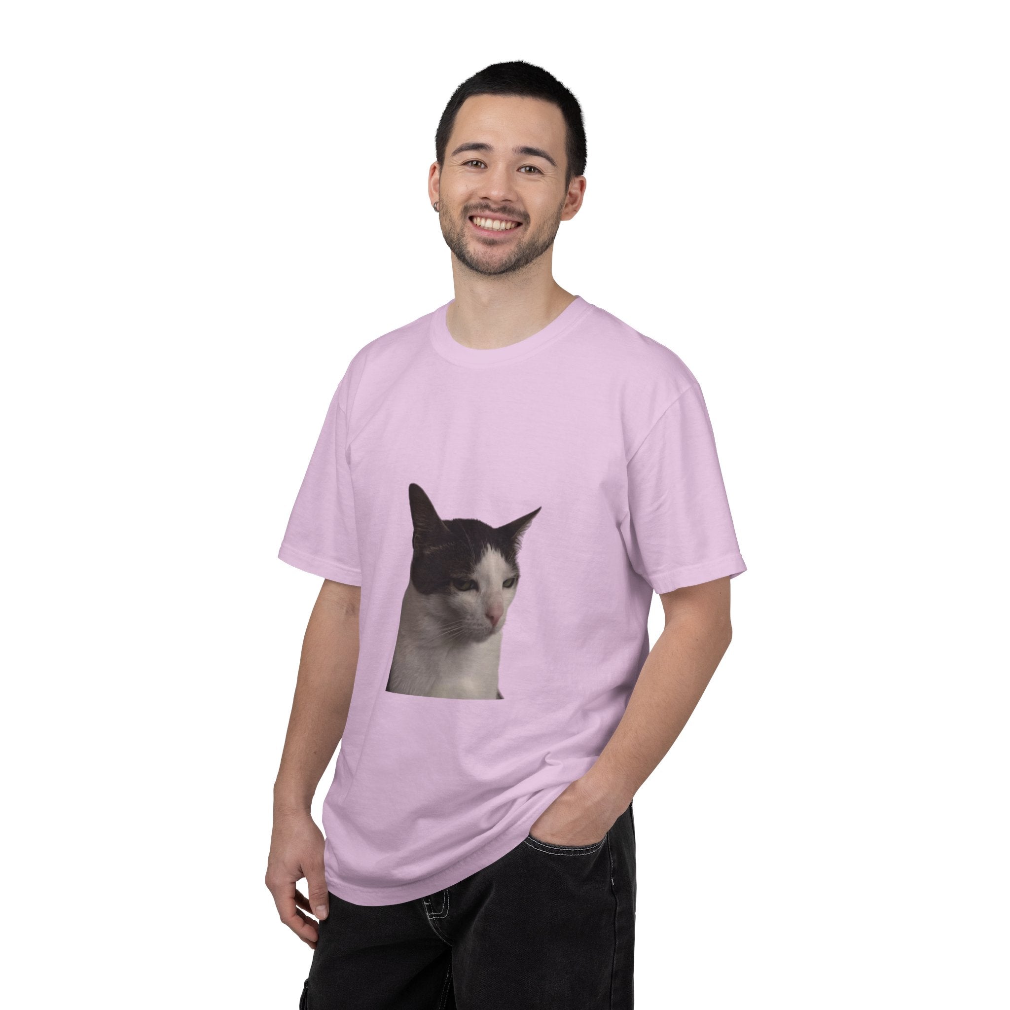 Man wearing a pink t-shirt with a cat graphic on a white background