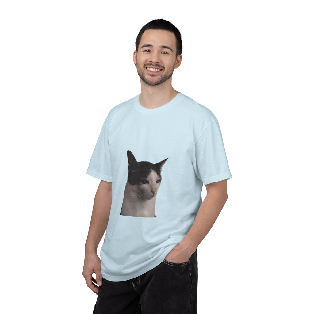 Man wearing a light blue t-shirt with a cat graphic on a white background