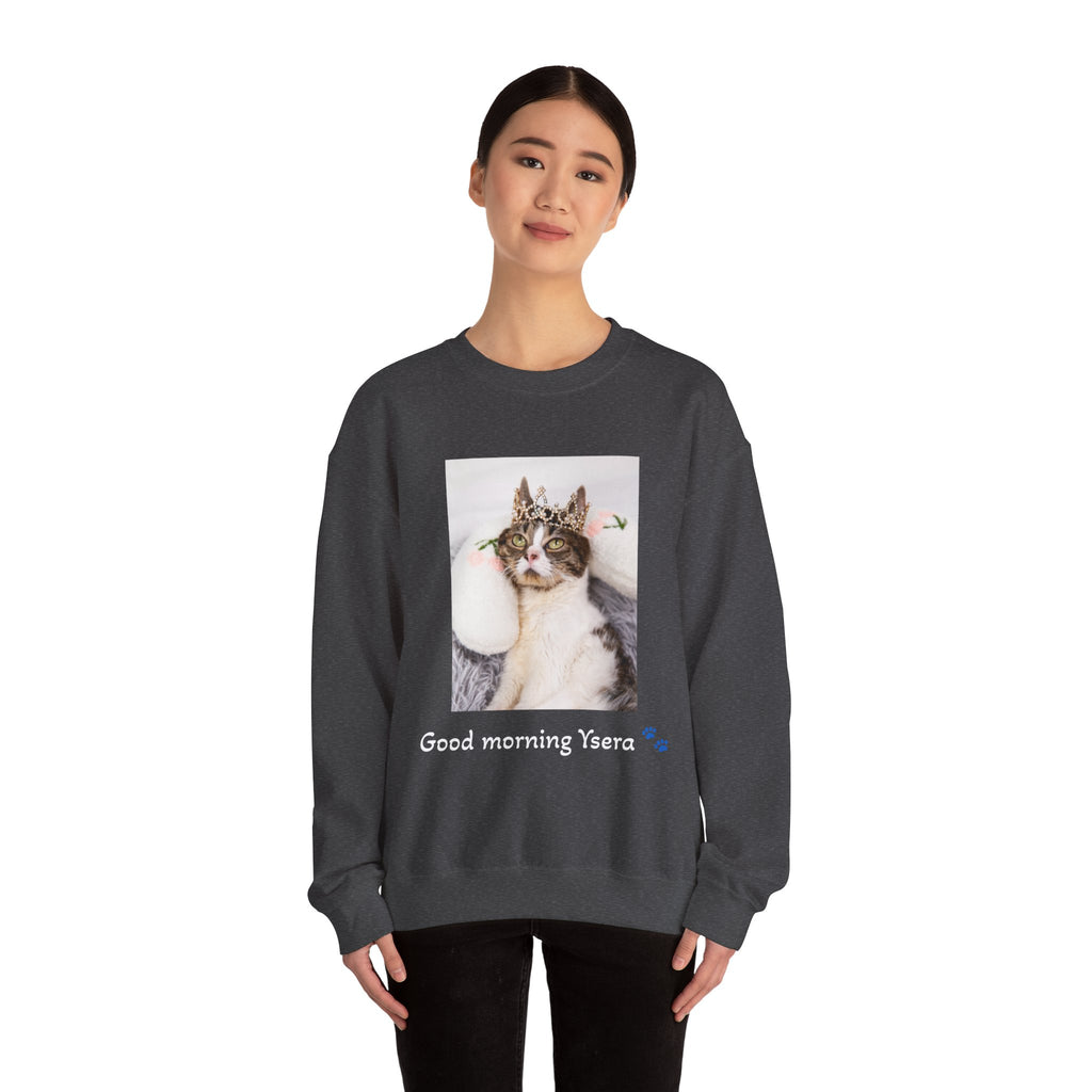 Person wearing a dark gray sweatshirt with a cat graphic and text on a white background