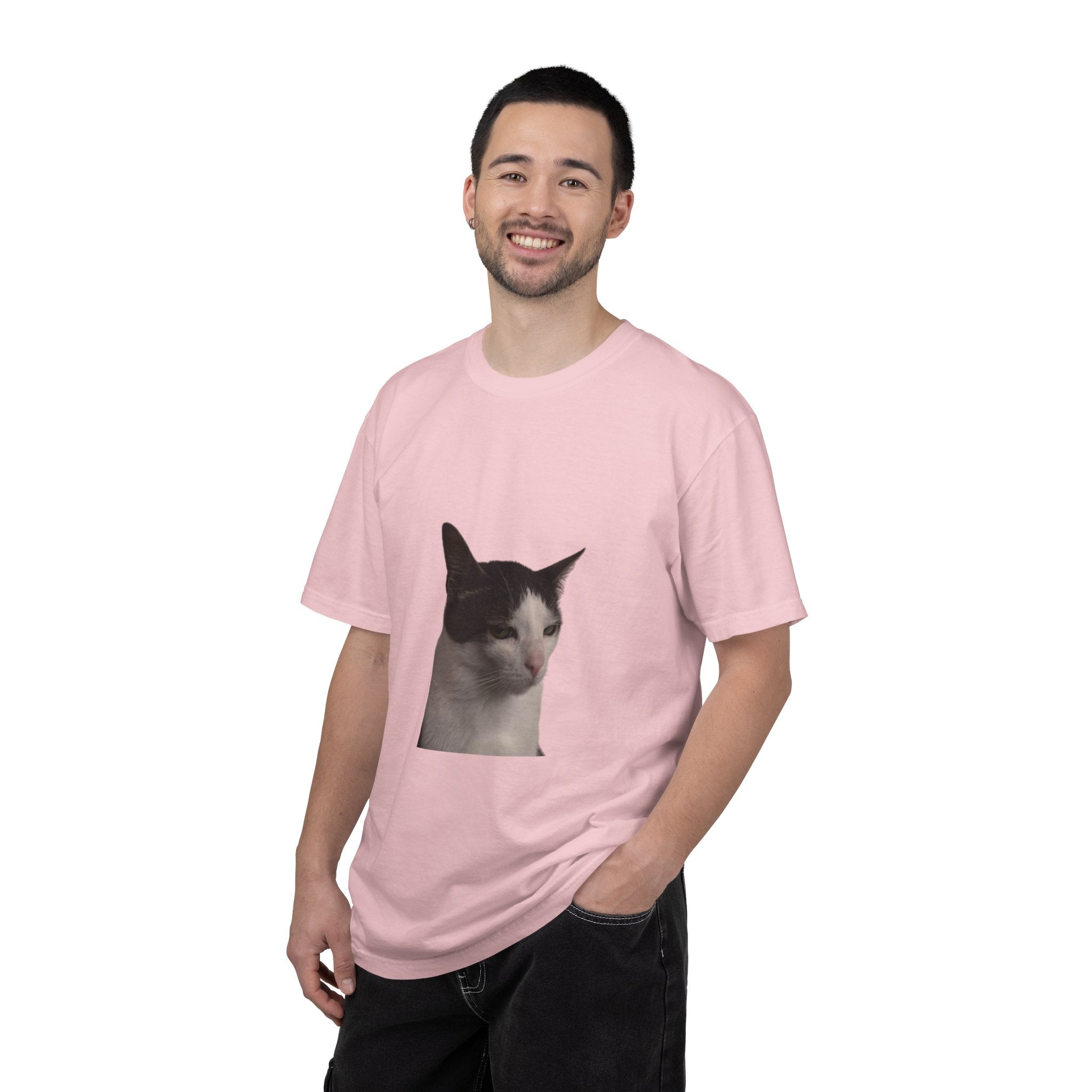 Man wearing a pink t-shirt with a cat graphic on a white background