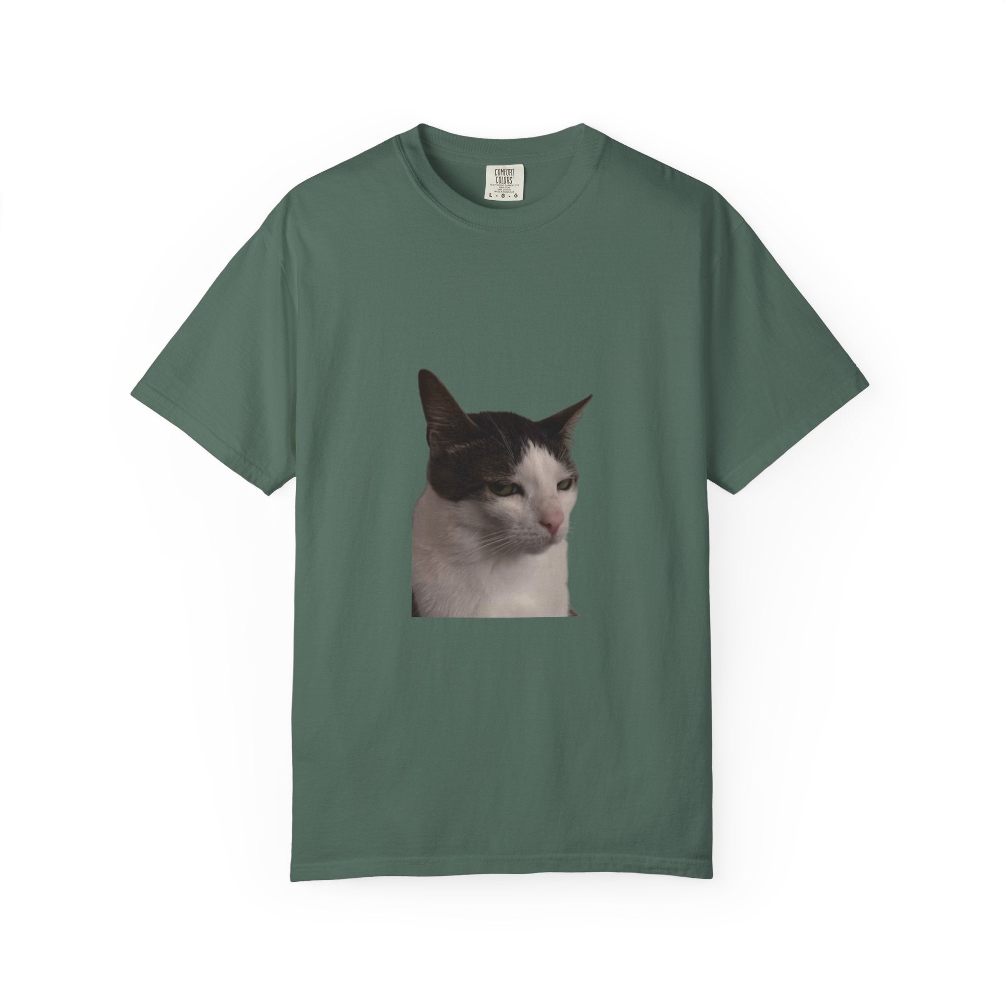 Green t-shirt with a cat's face printed on it against a white background