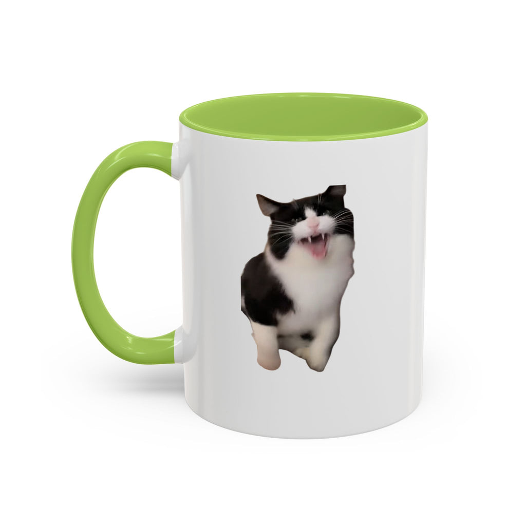 White mug with green handle and interior, featuring a cat illustration on a white background