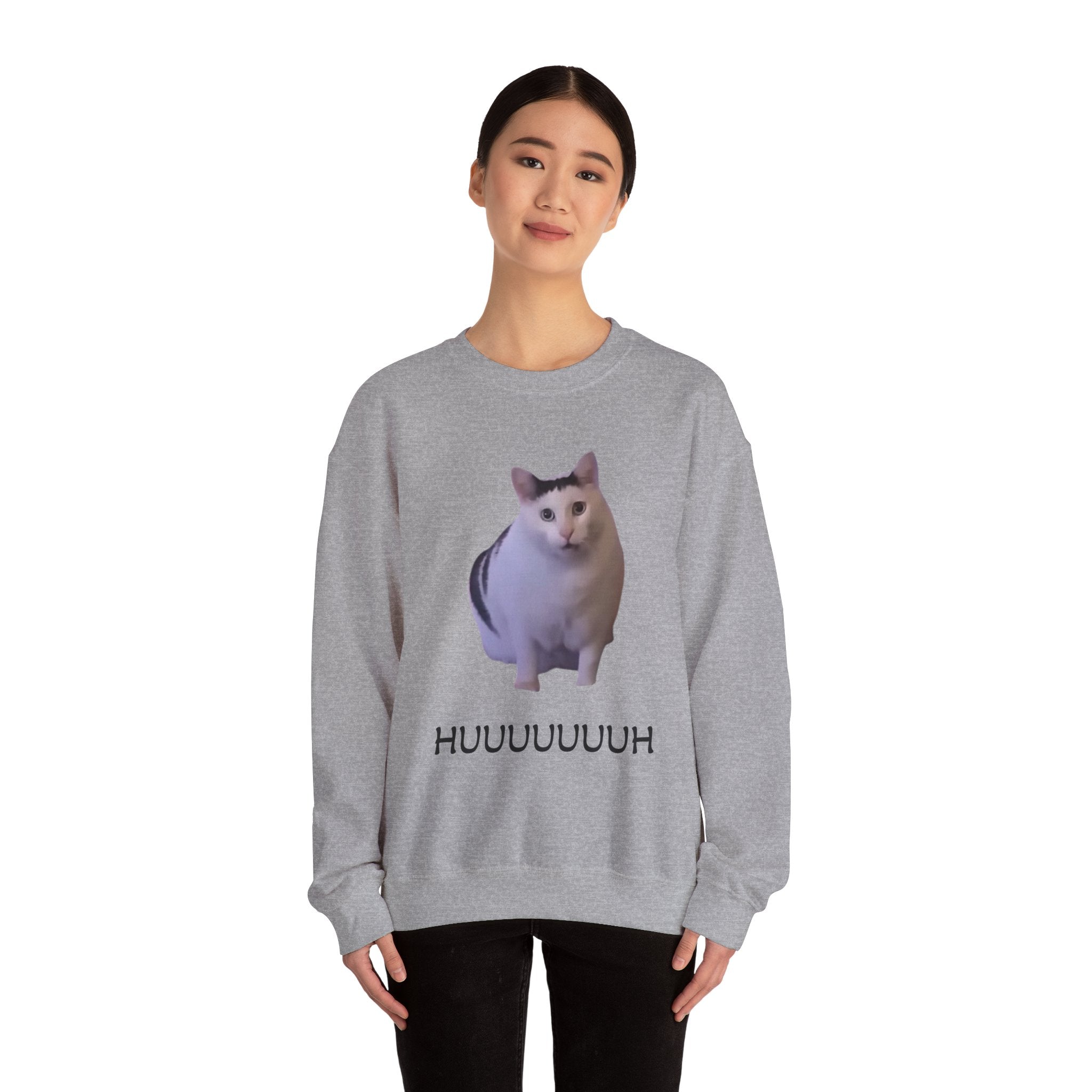 Person wearing a gray sweatshirt with a cat graphic and 'HUUUUUU' text on a white background